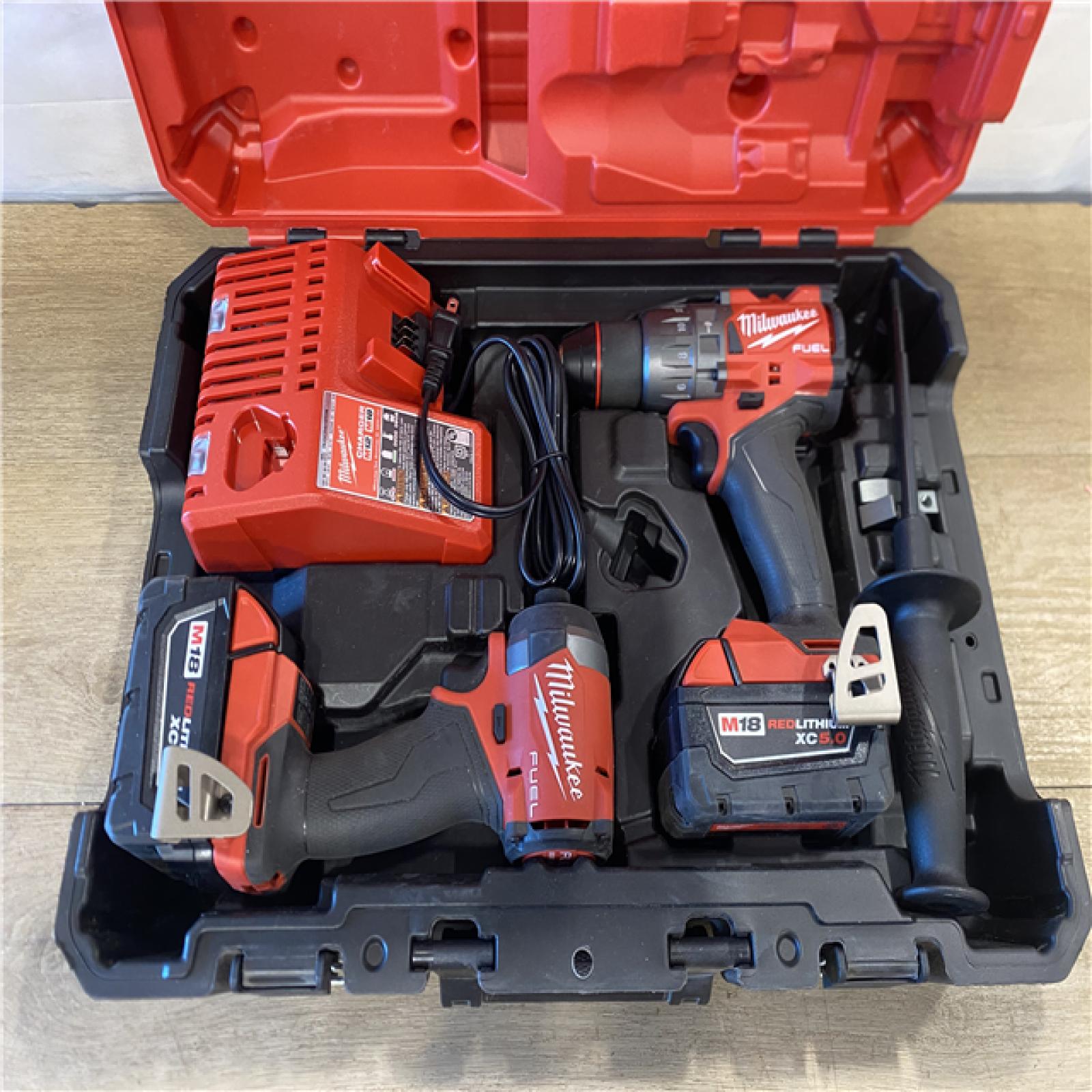AS-IS Milwaukee FUEL 18V Lithium-Ion Brushless Cordless Hammer Drill and Impact Driver Combo Kit