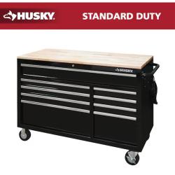 DALLAS LOCATION - Husky 52 in. W x 25 in. D Standard Duty 9-Drawer Mobile Workbench Tool Chest with Solid Wood Top in Gloss Black
