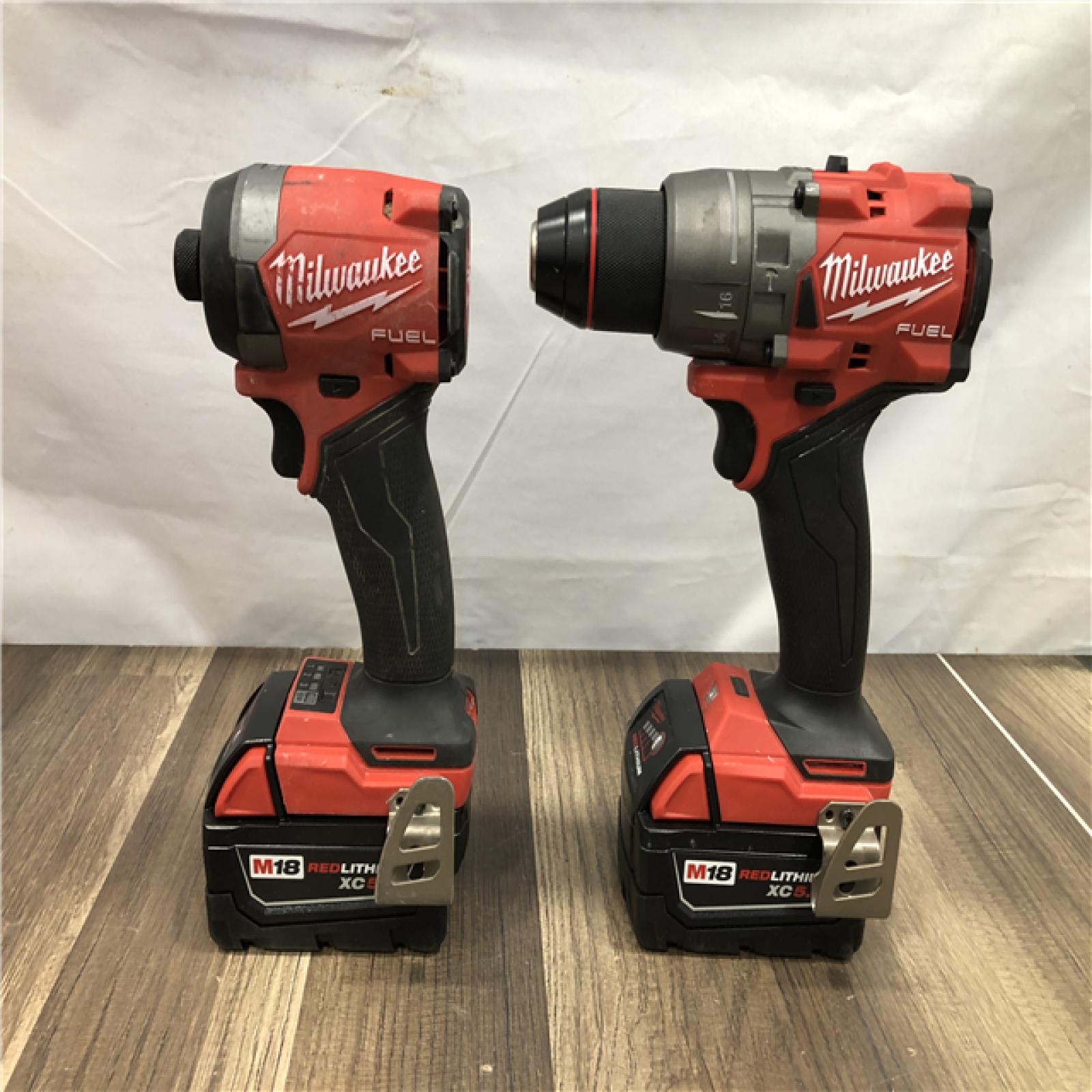 AS-IS Milwaukee FUEL 18V Lithium-Ion Brushless Cordless Hammer Drill and Impact Driver Combo Kit