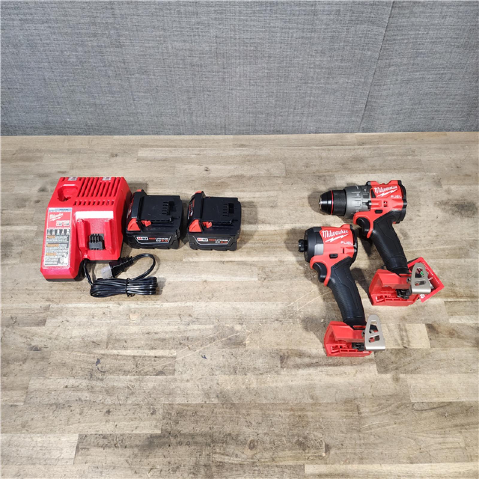 HOUSTON LOCATION - AS-IS (APPEARS LIKE NEW) Milwaukee 18V Lithium-Ion Brushless Cordless Hammer Drill and Impact Driver Combo Kit