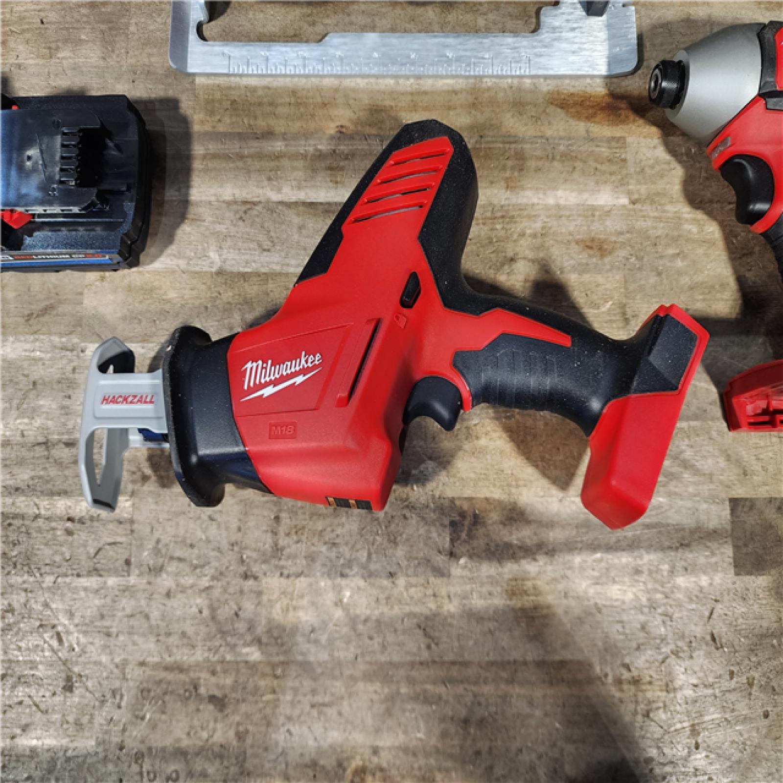 HOUSTON LOCATION - AS-IS Milwaukee M18 18-Volt Lithium-Ion Brushless Cordless Combo Kit (4-Tool) with 2-Batteries  1-Charger and Tool Bag