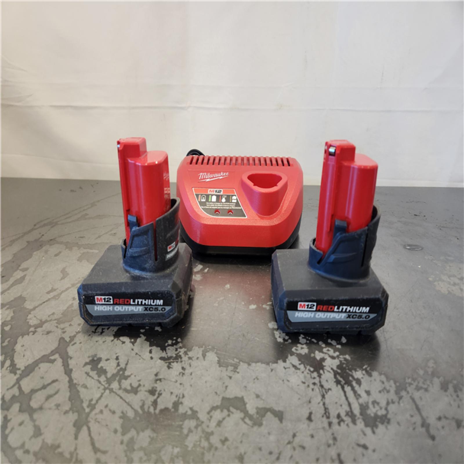 AS-IS- Milwaukee 12V Lithium-Ion XC High Output 5.0 Ah Battery Pack (2-Pack) Starter Kit with Charger