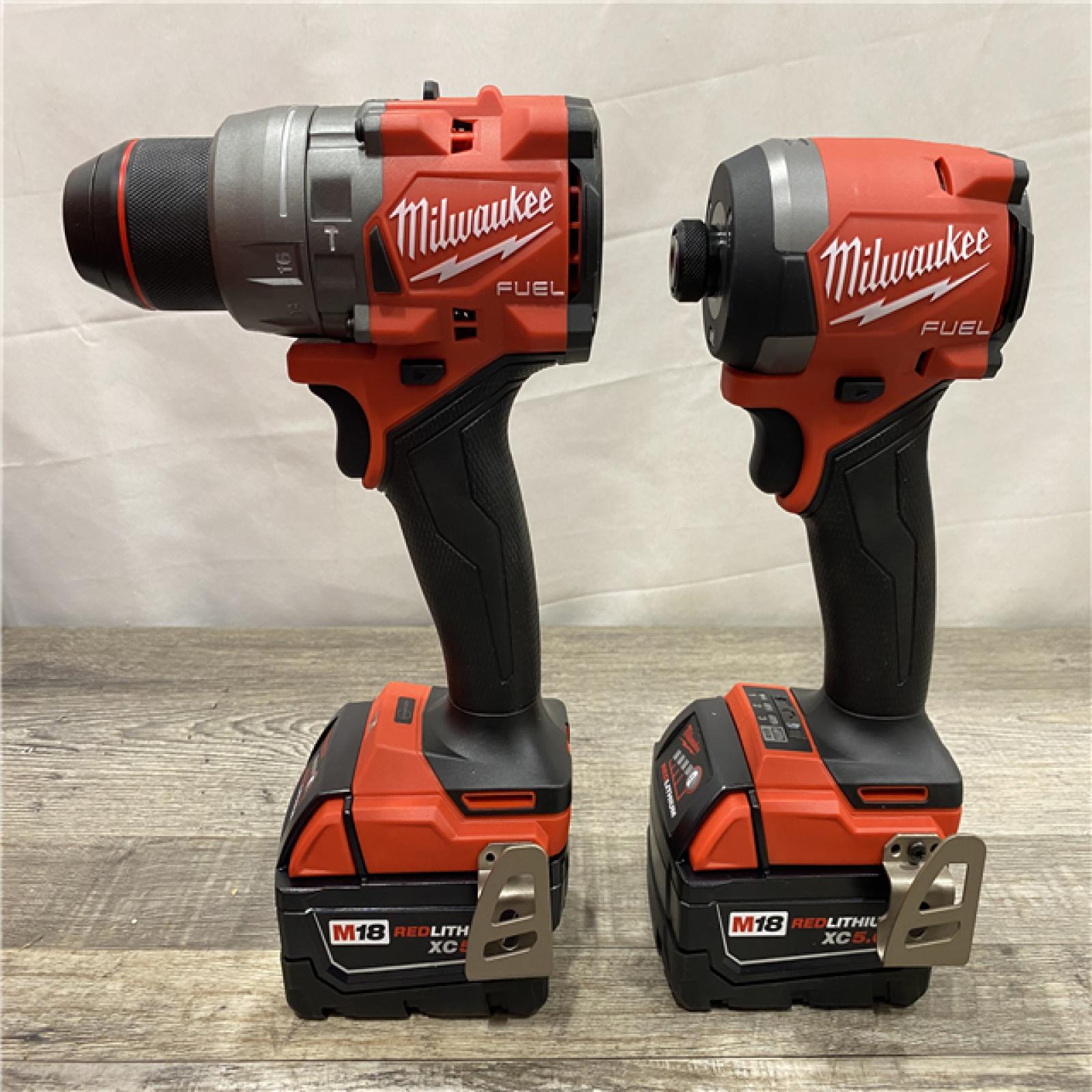 AS-IS Milwaukee FUEL 18V Lithium-Ion Brushless Cordless Hammer Drill and Impact Driver Combo Kit
