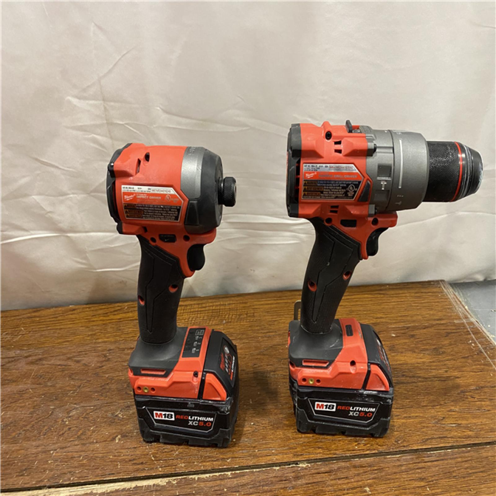 AS- IS MILWAUKEE M18 FUEL 18V Lithium-Ion Brushless Cordless Hammer Drill and Impact Driver Combo Kit (2-Tool) with 2 Batteries