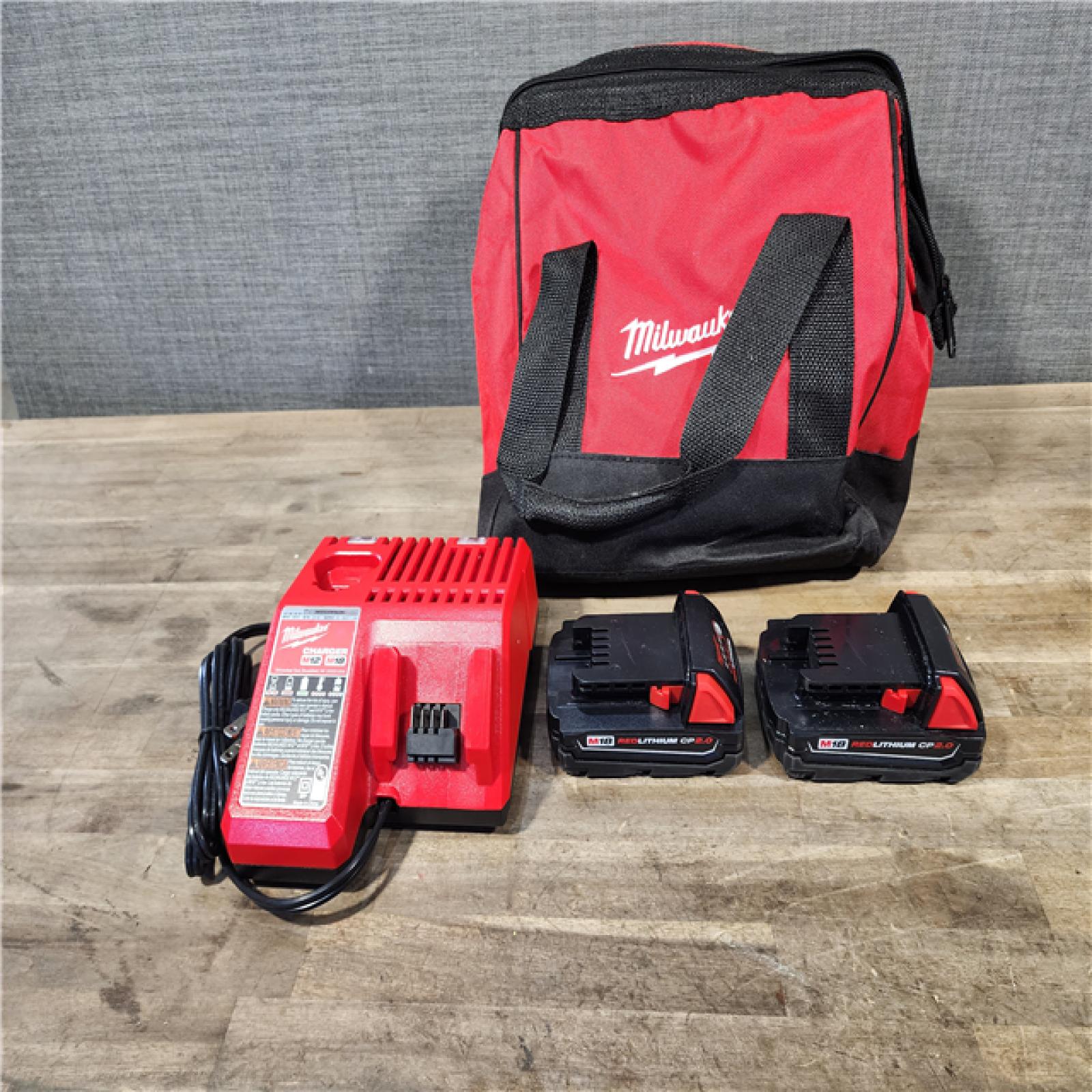 HOUSTON LOCATION - AS-IS Milwaukee M18 18V Lithium-Ion Brushless Cordless Compact Drill/Impact Combo Kit (2-Tool) W/(2) 2.0 Ah Batteries  Charger & Bag