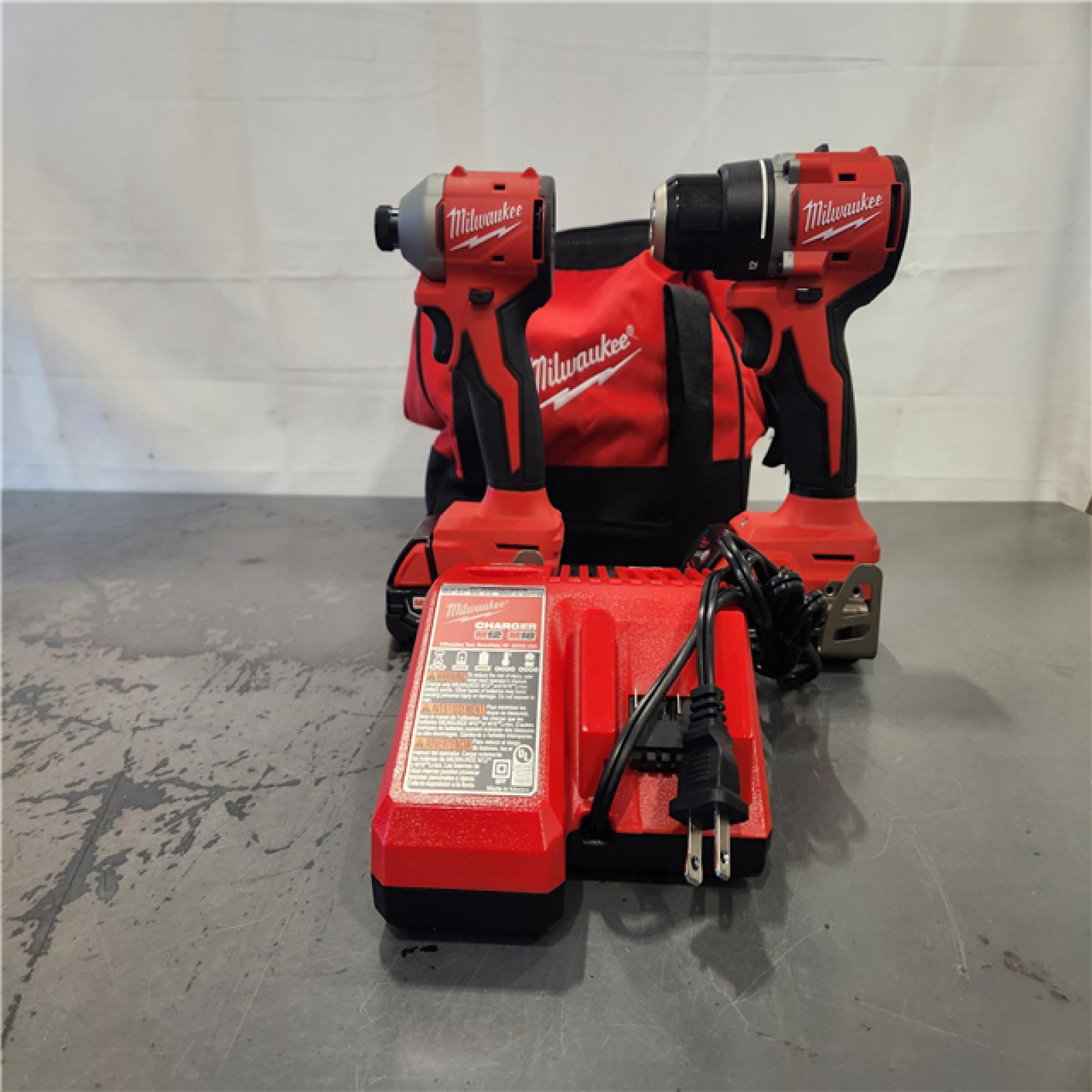 AS-IS- Milwaukee M18 18V Lithium-Ion Brushless Cordless Compact Drill/Impact Combo Kit (2-Tool) W/(2) 2.0 Ah Batteries  Charger & Bag