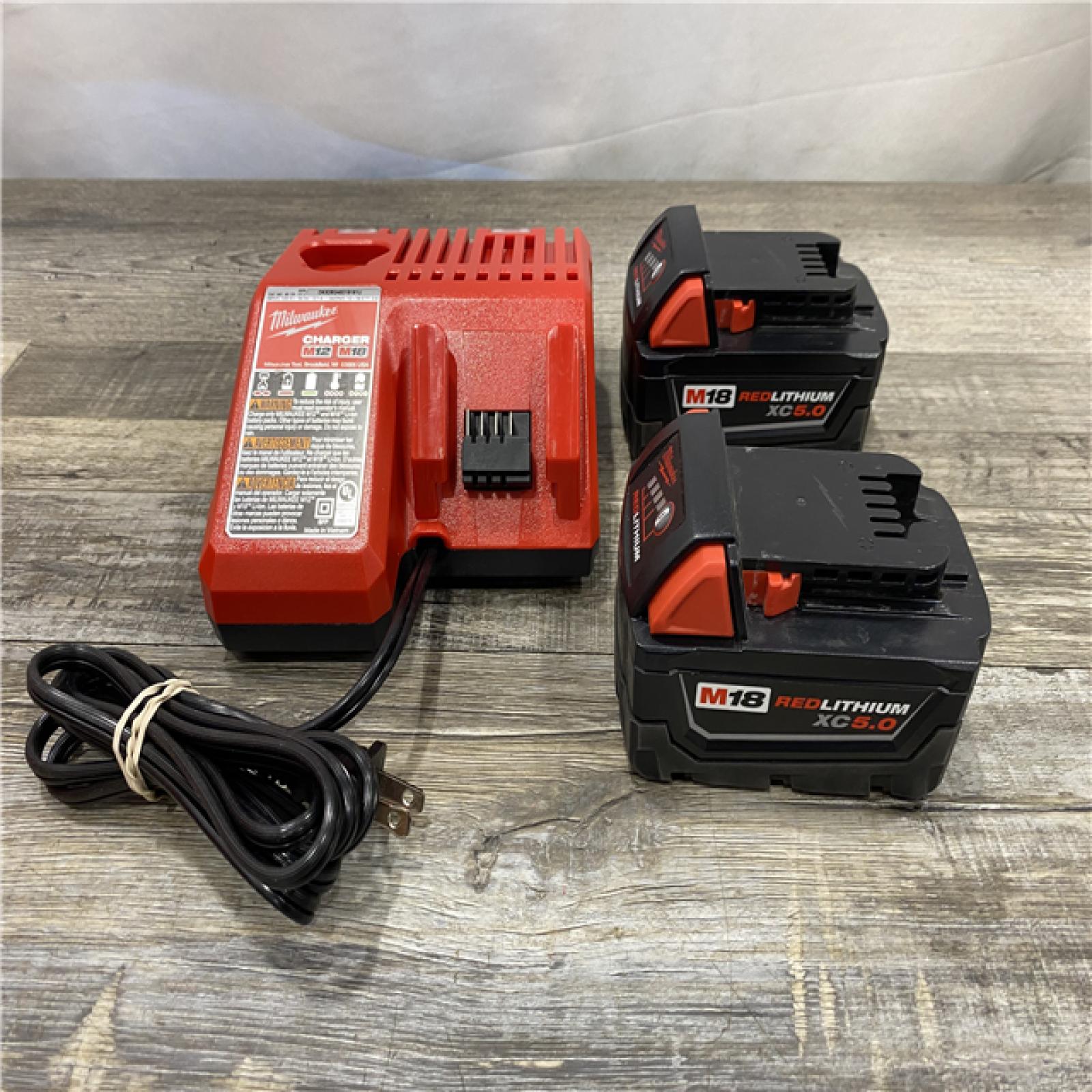 AS-IS Milwaukee 18-Volt Lithium-Ion XC Starter Kit with Two 5.0Ah Batteries and Charger
