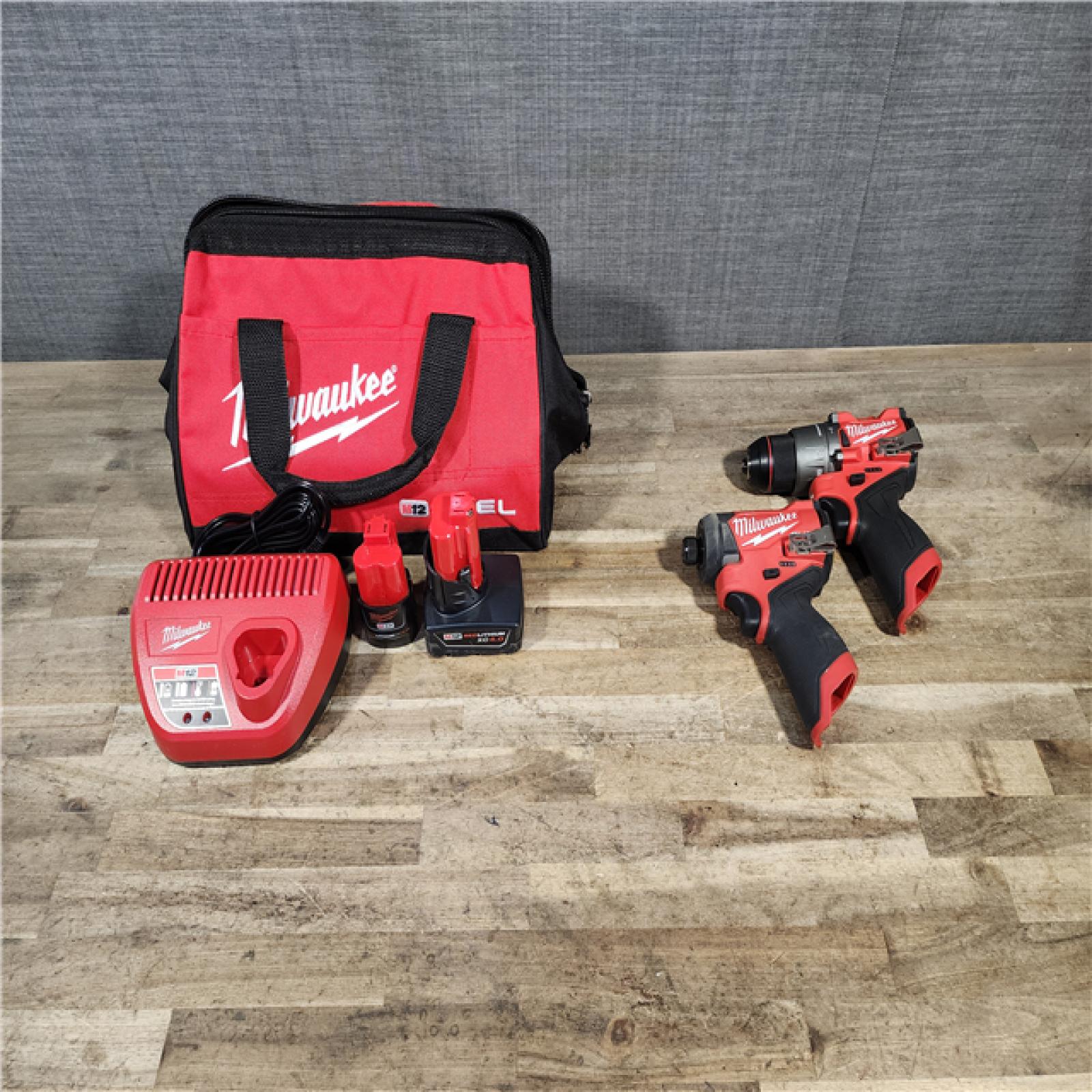 HOUSTON LOCATION - AS-IS Milwaukee FUEL 12-Volt Lithium-Ion Brushless Cordless Hammer Drill and Impact Driver Combo Kit