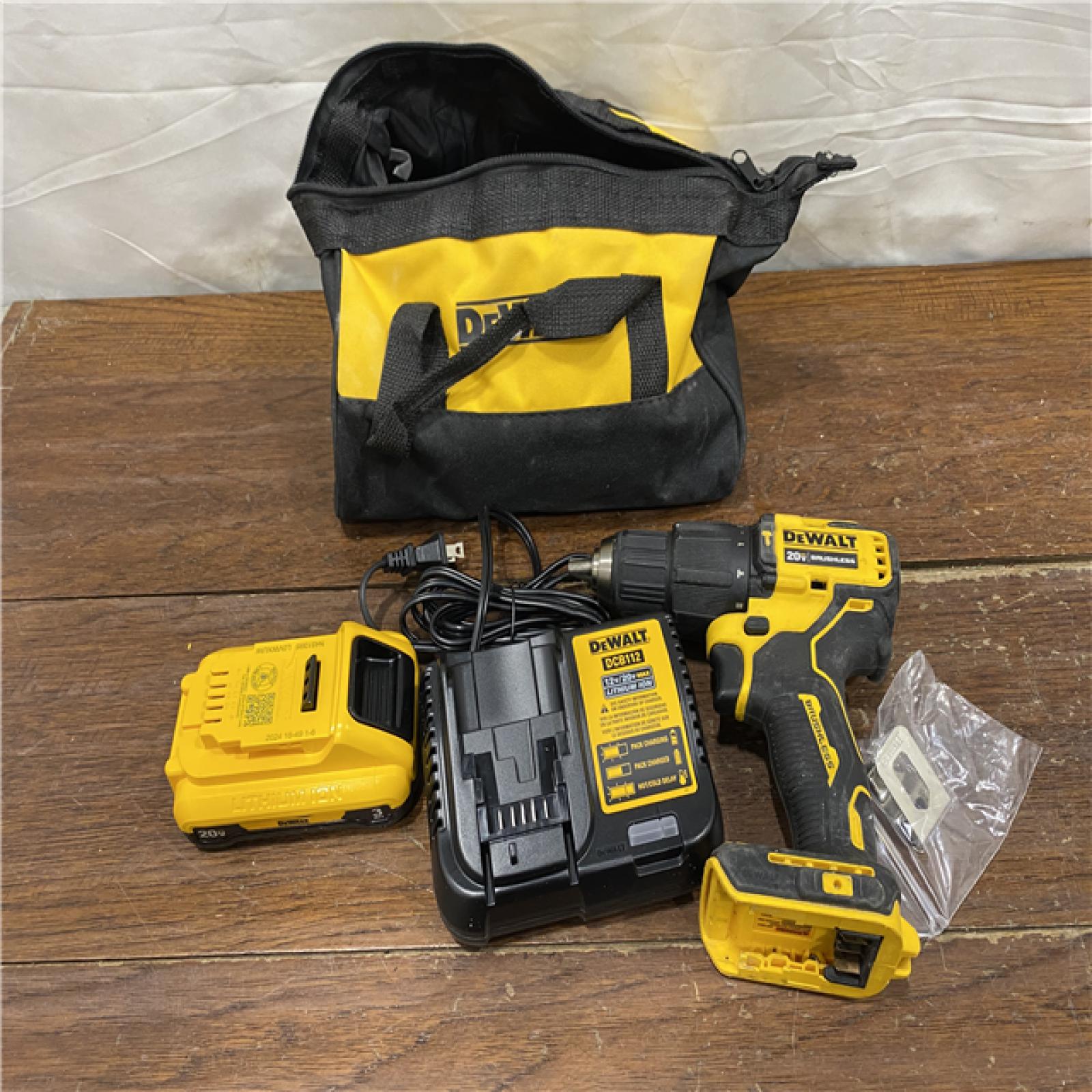AS-IS DEWALT ATOMIC 20-Volt Lithium-Ion Cordless 1/2 in. Compact Hammer Drill with 3.0Ah Battery, Charger and Bag