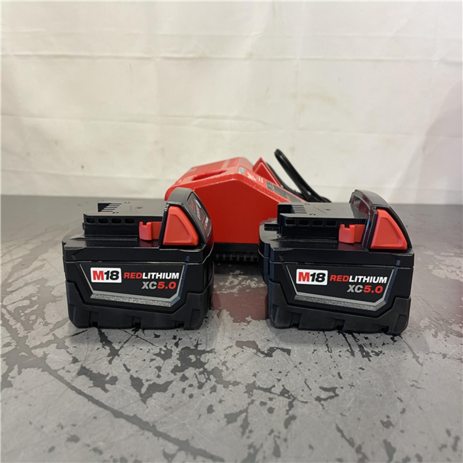 AS-IS- Milwaukee M18 18-Volt Lithium-Ion XC Starter Kit with Two 5.0Ah Batteries and Charger
