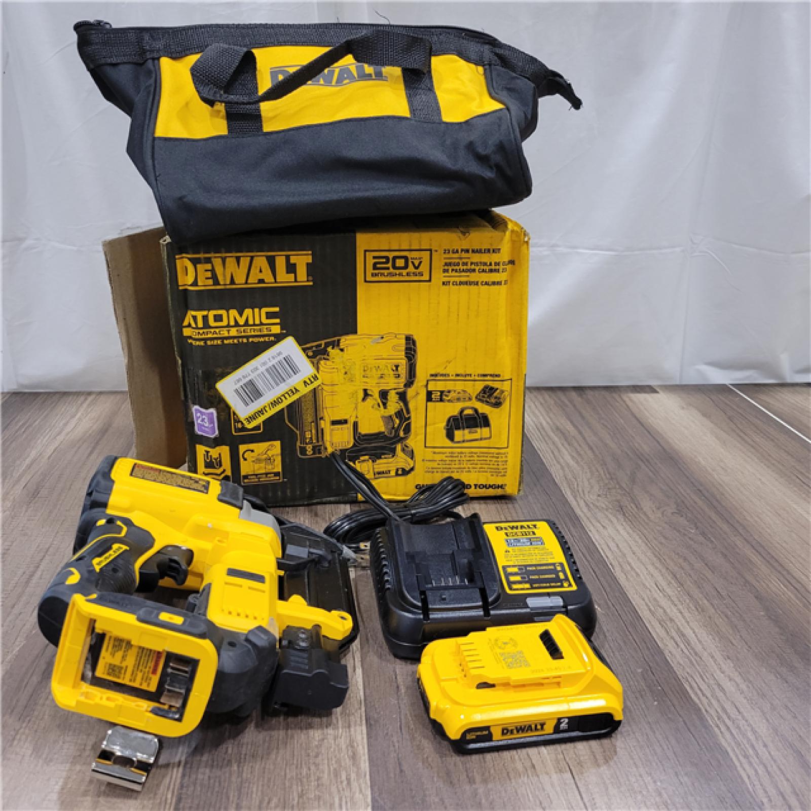 AS-IS DEWALT ATOMIC 20V MAX Lithium Ion Cordless 23 Gauge Pin Nailer Kit with 3.0Ah Battery and Charger