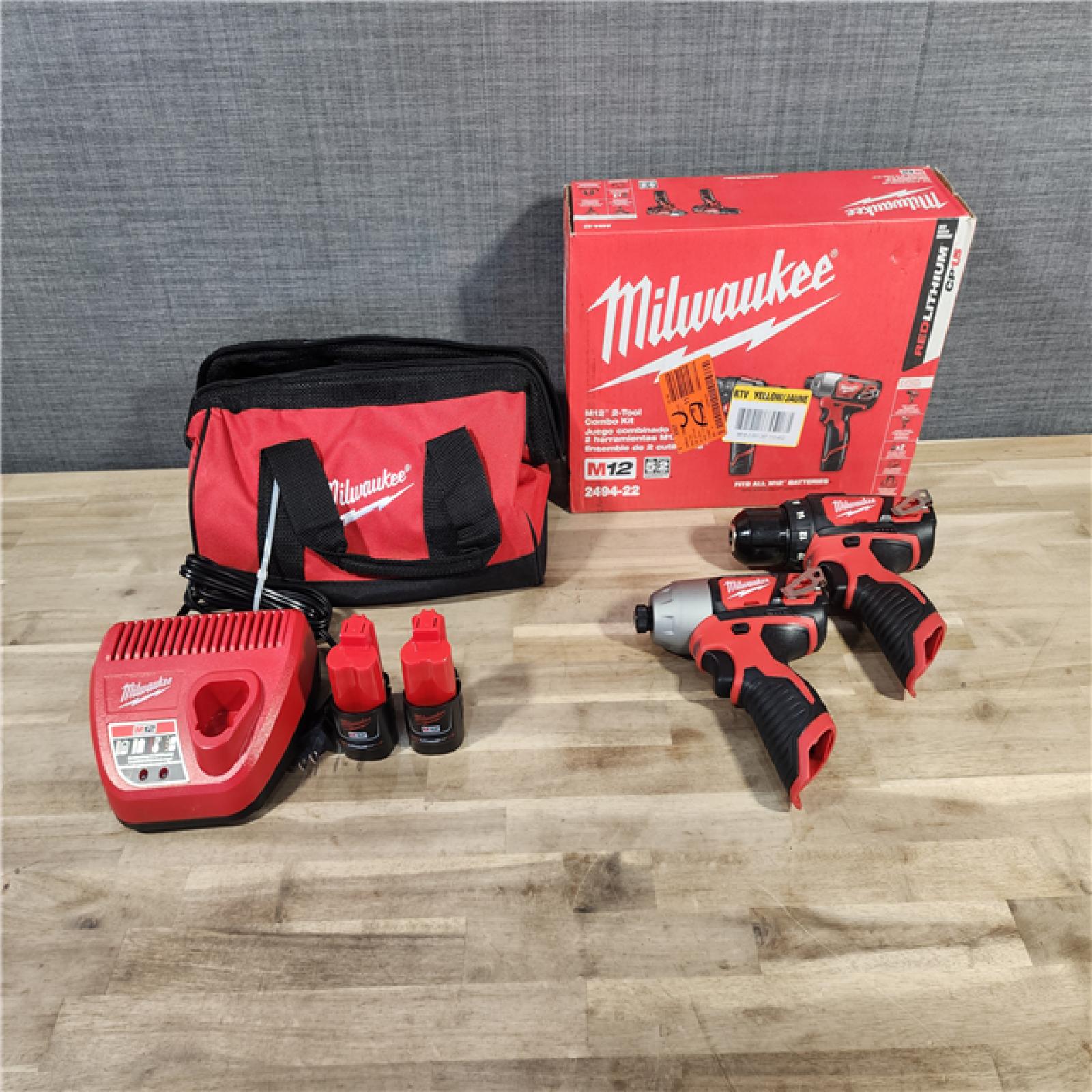 HOUSTON LOCATION - AS-IS Milwaukee M12 12V Lithium-Ion Cordless Drill Driver/Impact Driver Combo Kit with Two 1.5Ah Batteries, Charger and Bag (2-Tool)
