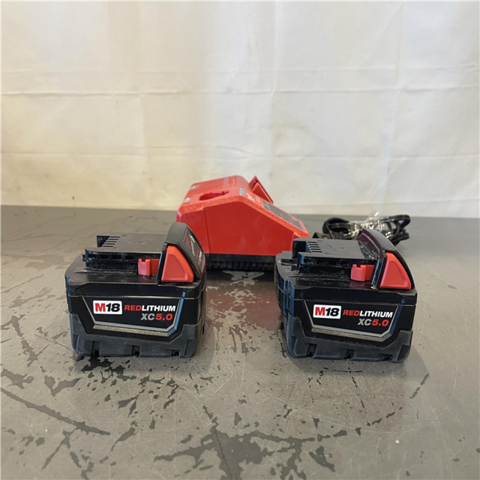 AS-IS- Milwaukee M18 18-Volt Lithium-Ion XC Starter Kit with Two 5.0Ah Batteries and Charger