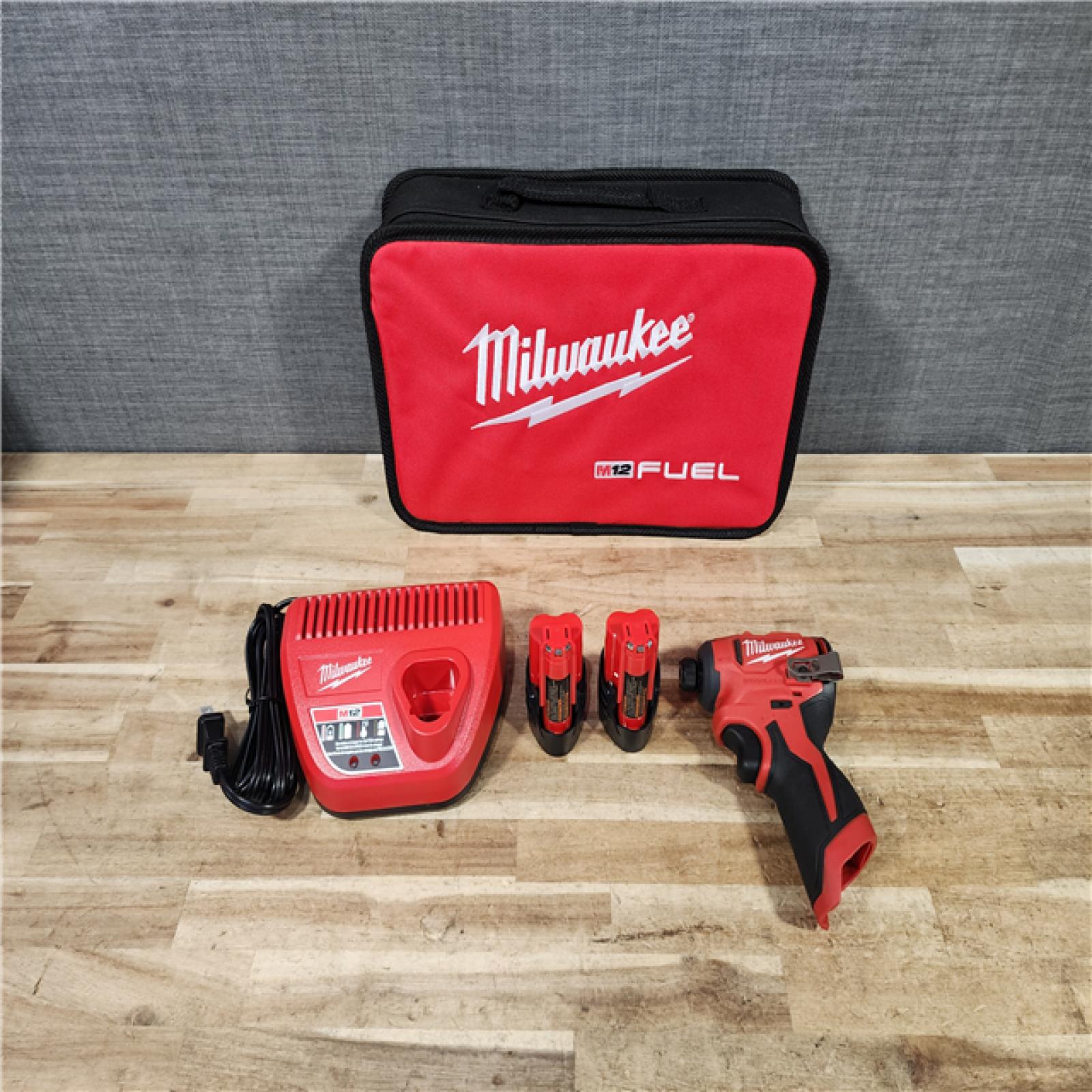 HOUSTON LOCATION - AS - IS Milwaukee FUEL SURGE 12V Lithium-Ion Brushless Cordless 1/4 in. Hex Impact Driver Compact Kit