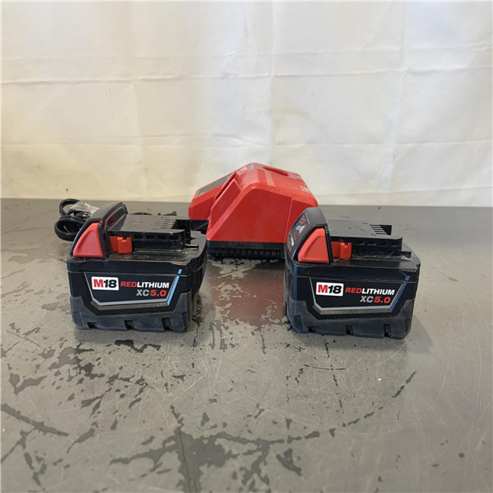 AS-IS- Milwaukee M18 18-Volt Lithium-Ion XC Starter Kit with Two 5.0Ah Batteries and Charger