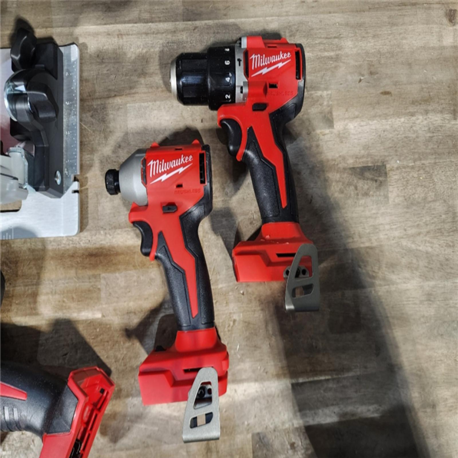 HOUSTON LOCATION - AS-IS Milwaukee M18 18-Volt Lithium-Ion Brushless Cordless Combo Kit (4-Tool) with 2-Batteries, 1-Charger and Tool Bag