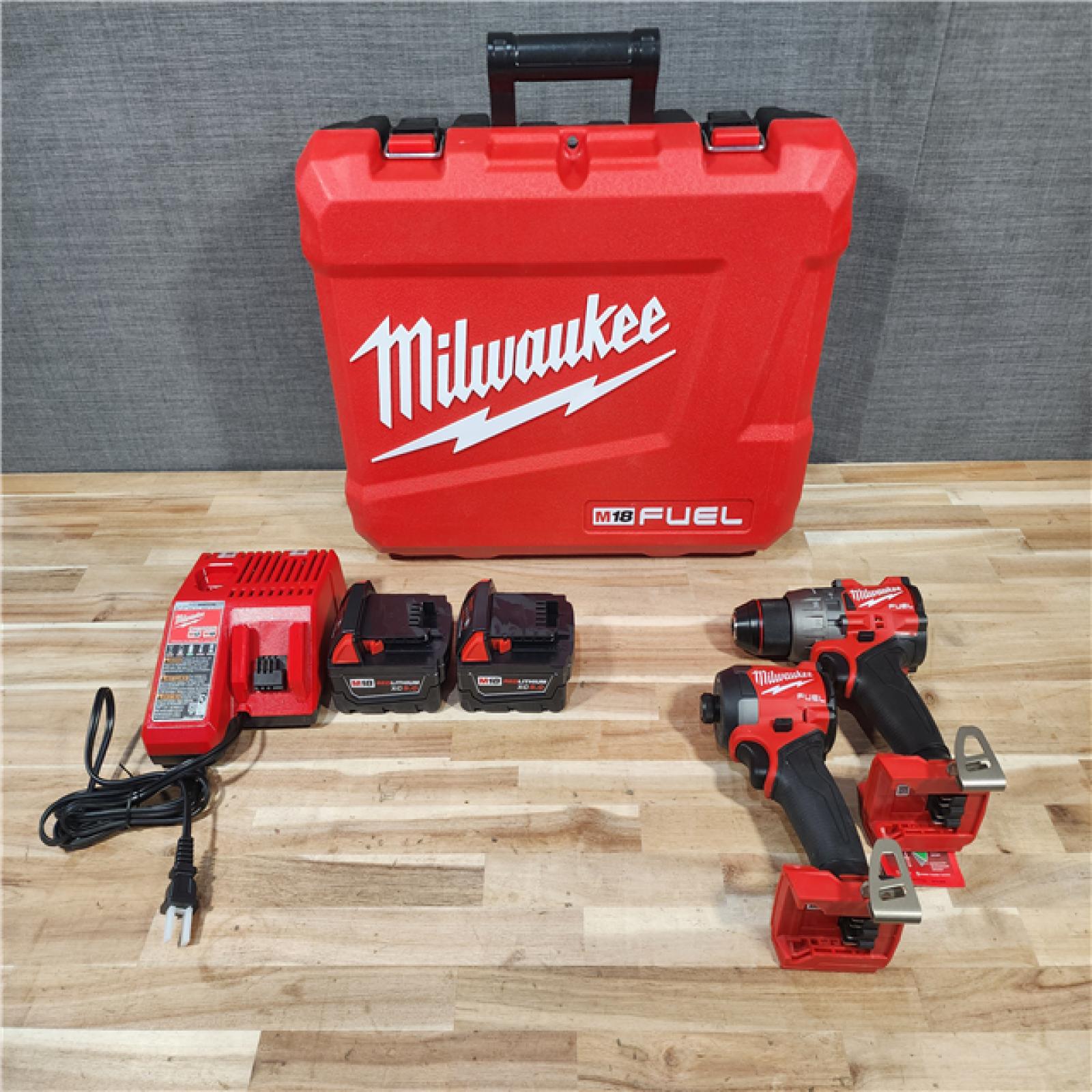 HOUSTON LOCATION - AS-IS (APPEARS LIKE NEW) Milwaukee  FUEL 18V Lithium-Ion Brushless Cordless Hammer Drill and Impact Driver Combo Kit