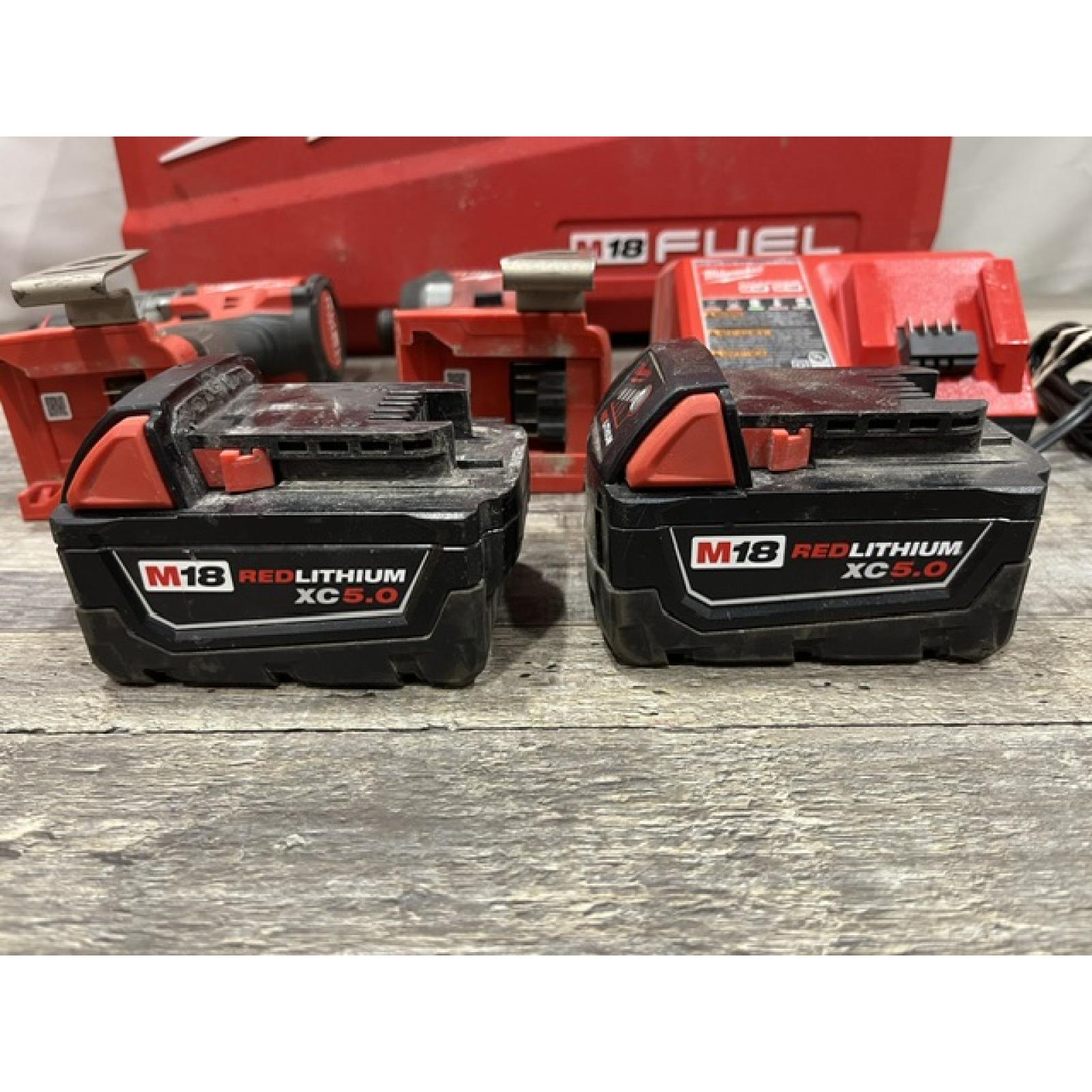 AS-IS Milwaukee FUEL 18V Lithium-Ion Brushless Cordless Hammer Drill and Impact Driver Combo Kit