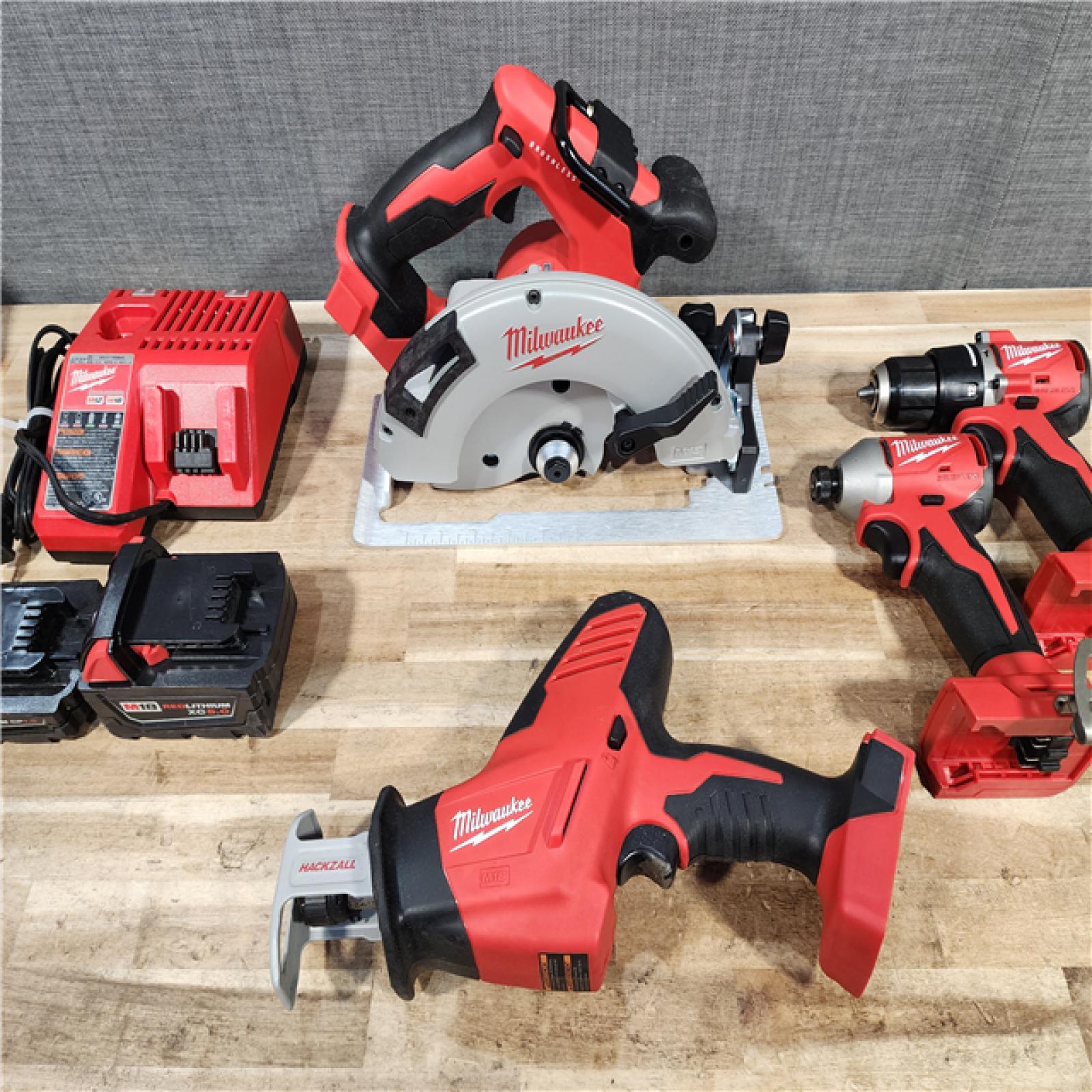 HOUSTON LOCATION - AS-IS MILWAUKEE 4 TOOL COMBO KIT W/ (2) BATTERY & CHARGER