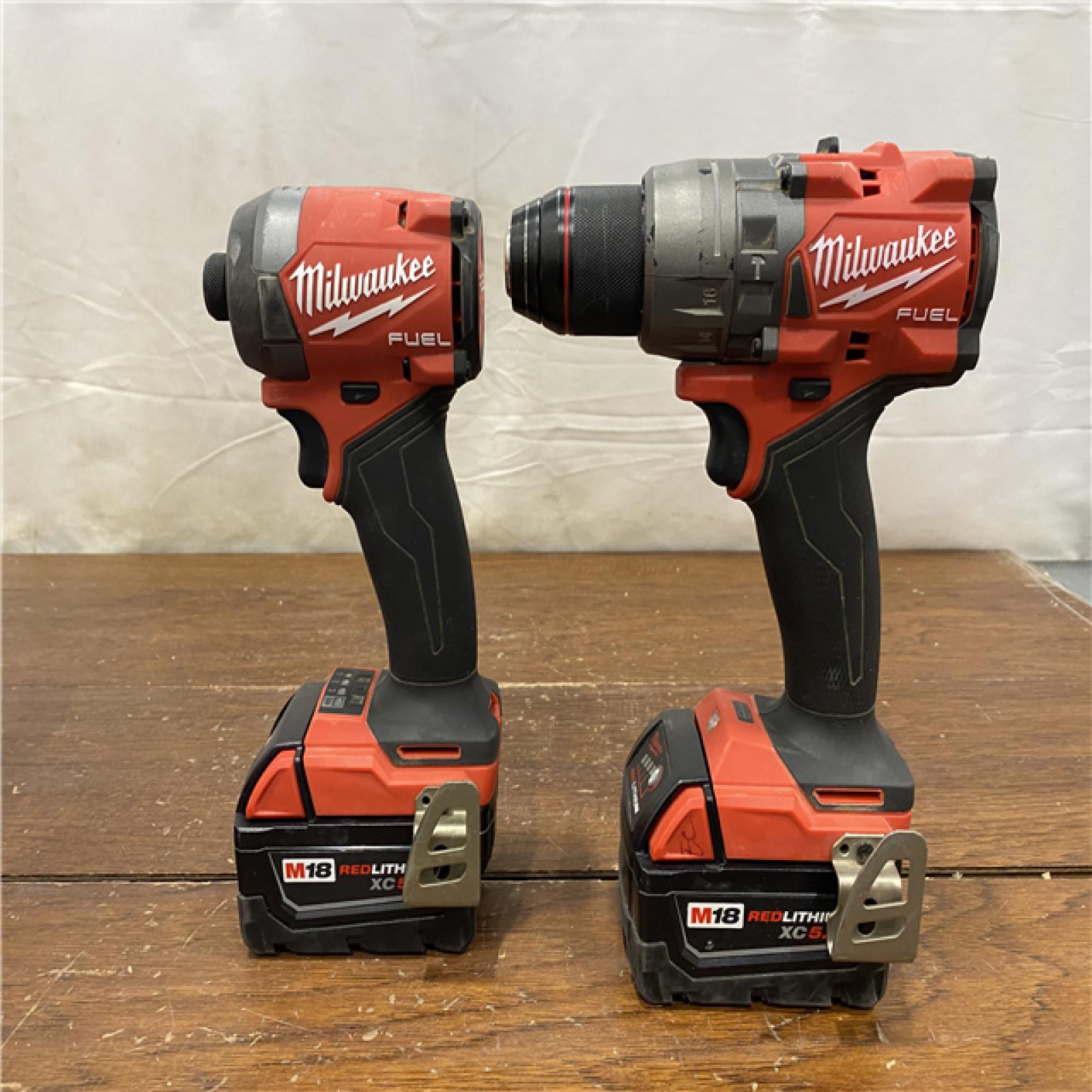 AS-IS MILWAUKEE M18 FUEL 18V Lithium-Ion Brushless Cordless Hammer Drill and Impact Driver Combo Kit (2-Tool) with 2 Batteries