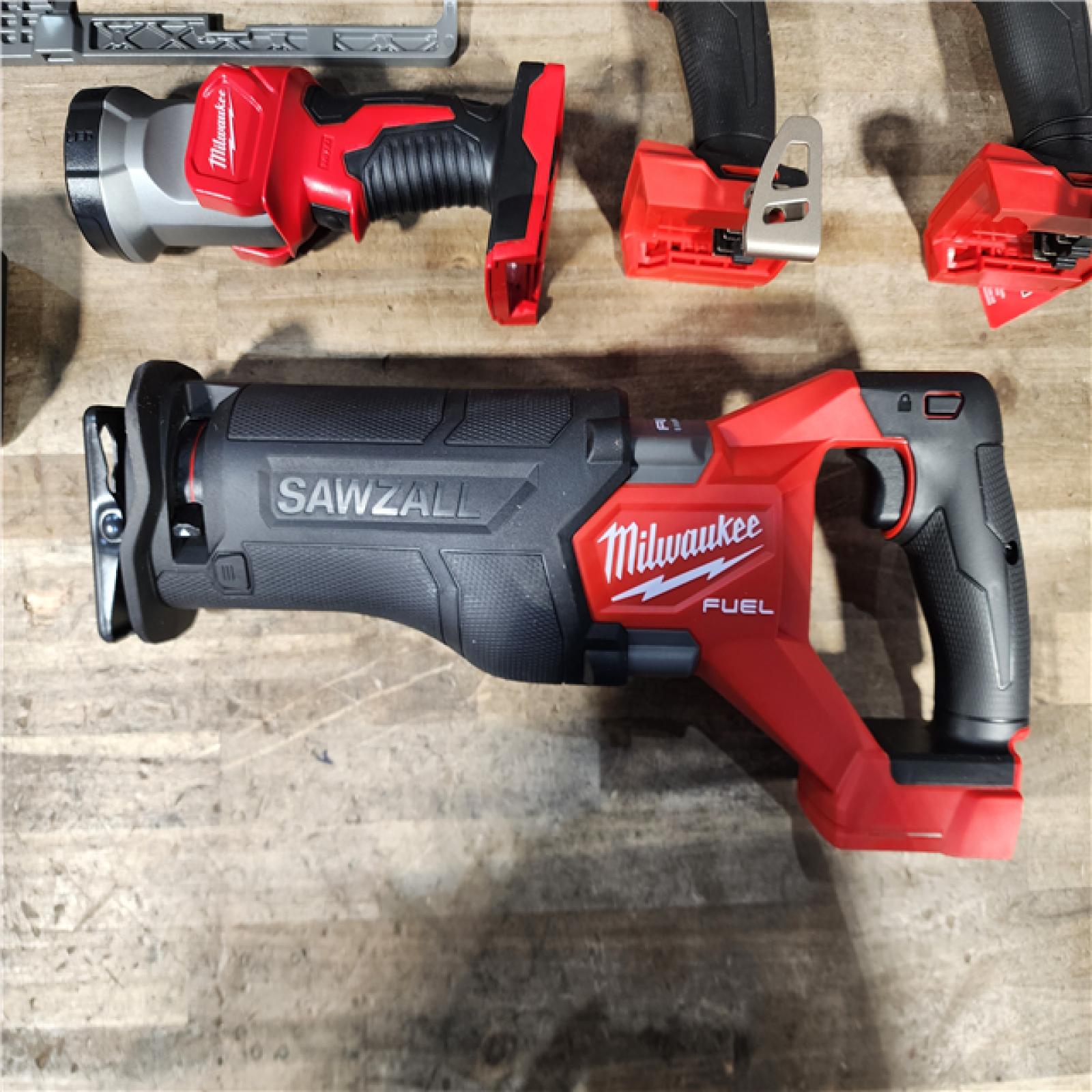 HOUSTON LOCATION - AS-IS (APPEARS LIKE NEW) M18 FUEL 18V Lithium-Ion Brushless Cordless 5-Tool Combo Kit with Two 5.0 Ah Batteries  1 Charger 1 Tool Bag