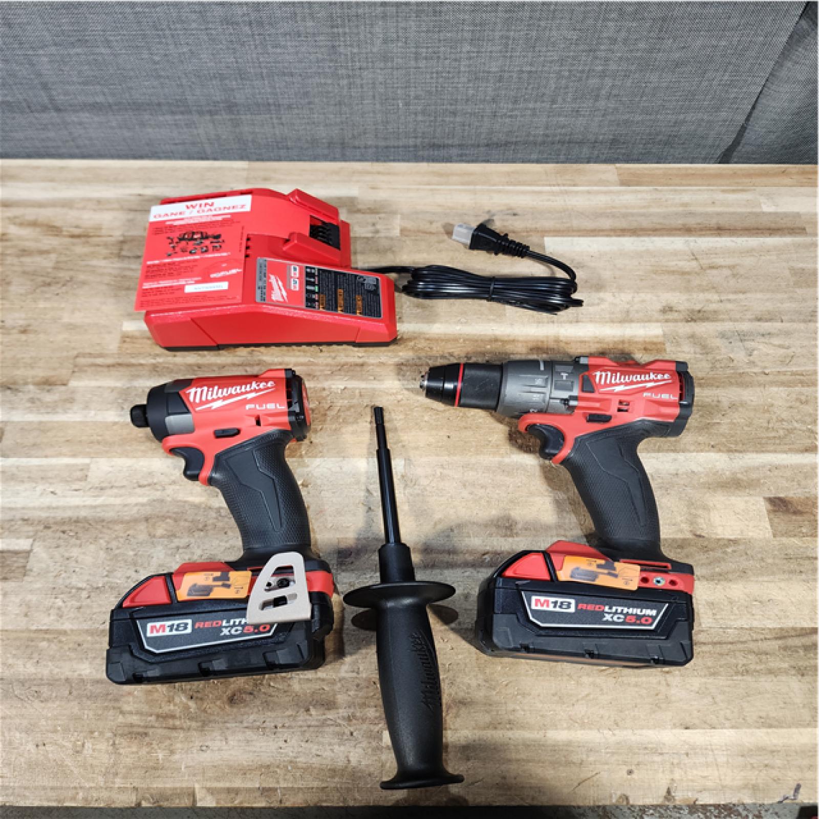Houston Location AS-IS Milwaukee FUEL 18V Lithium-Ion Brushless Cordless Hammer Drill and Impact Driver Combo Kit