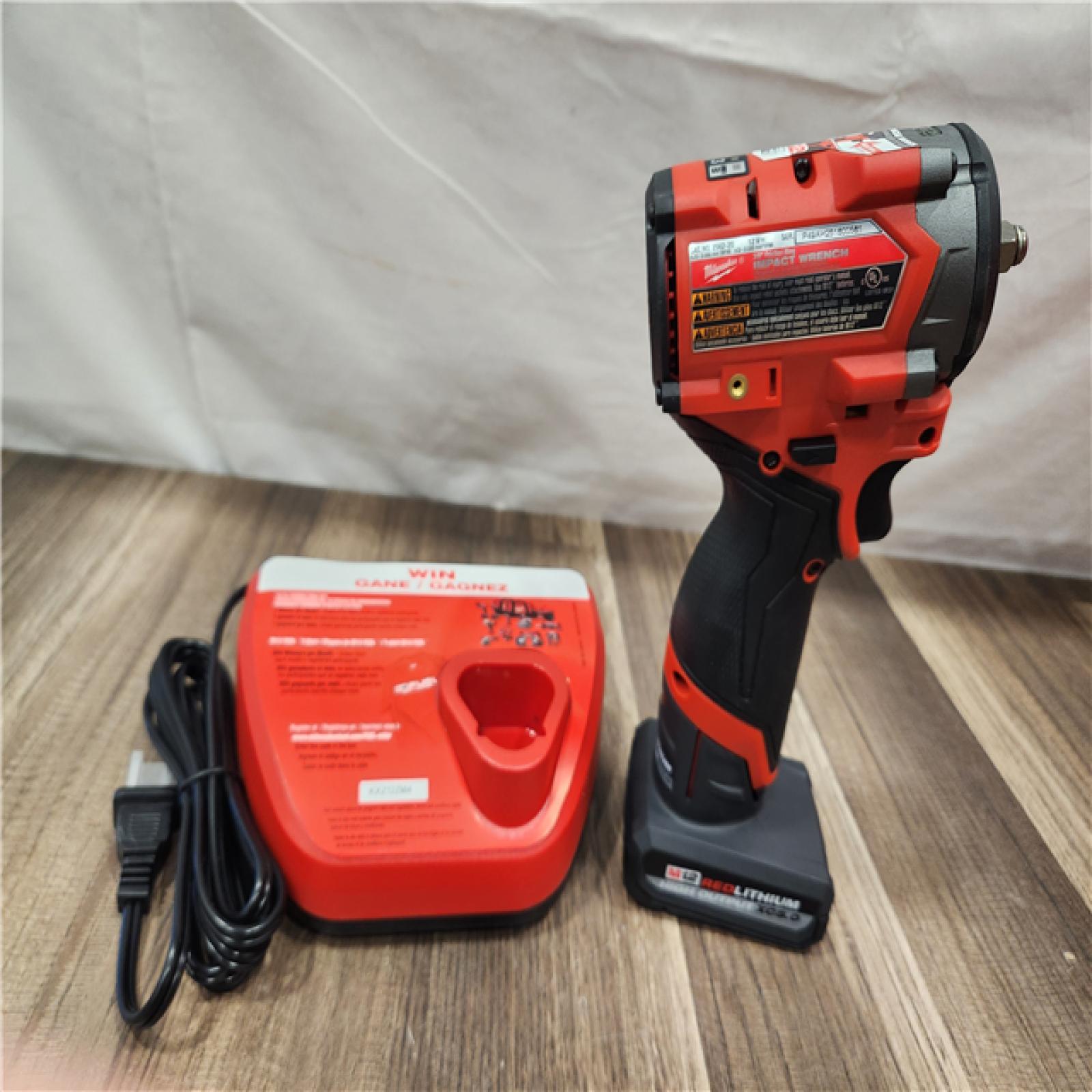 AS-IS- Milwaukee M12 FUEL 12V Li-Ion Brushless Cordless Stubby 3/8 in. Impact Wrench Kit W/(1) 5.0 Ah High Output Battery