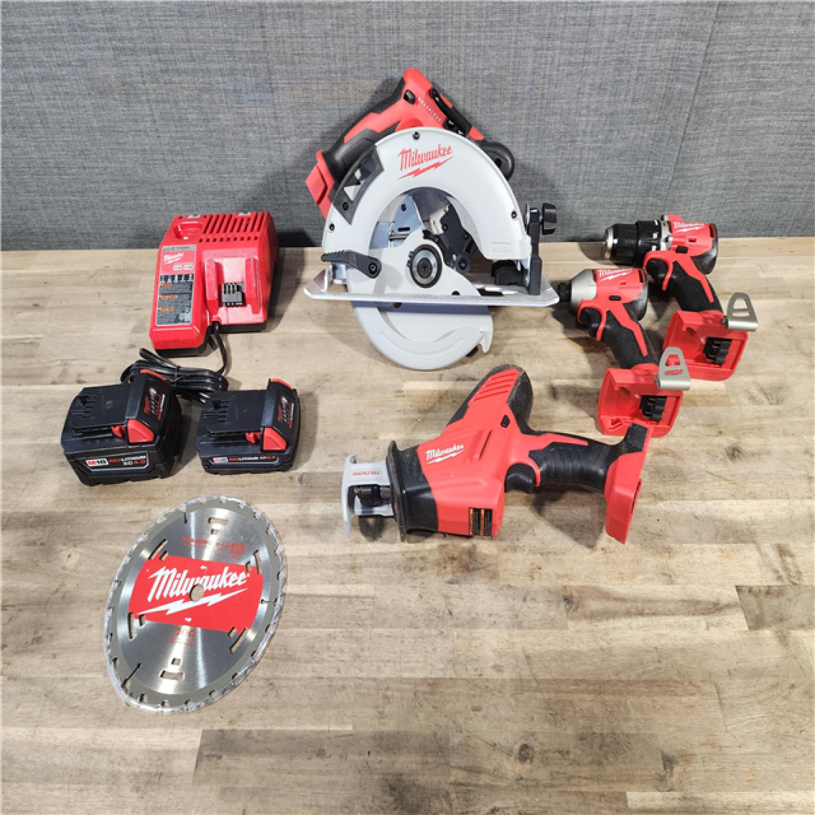 HOUSTON LOCATION - AS-IS Milwaukee M18 18-Volt Lithium-Ion Brushless Cordless Combo Kit (4-Tool) with 2-Batteries, 1-Charger