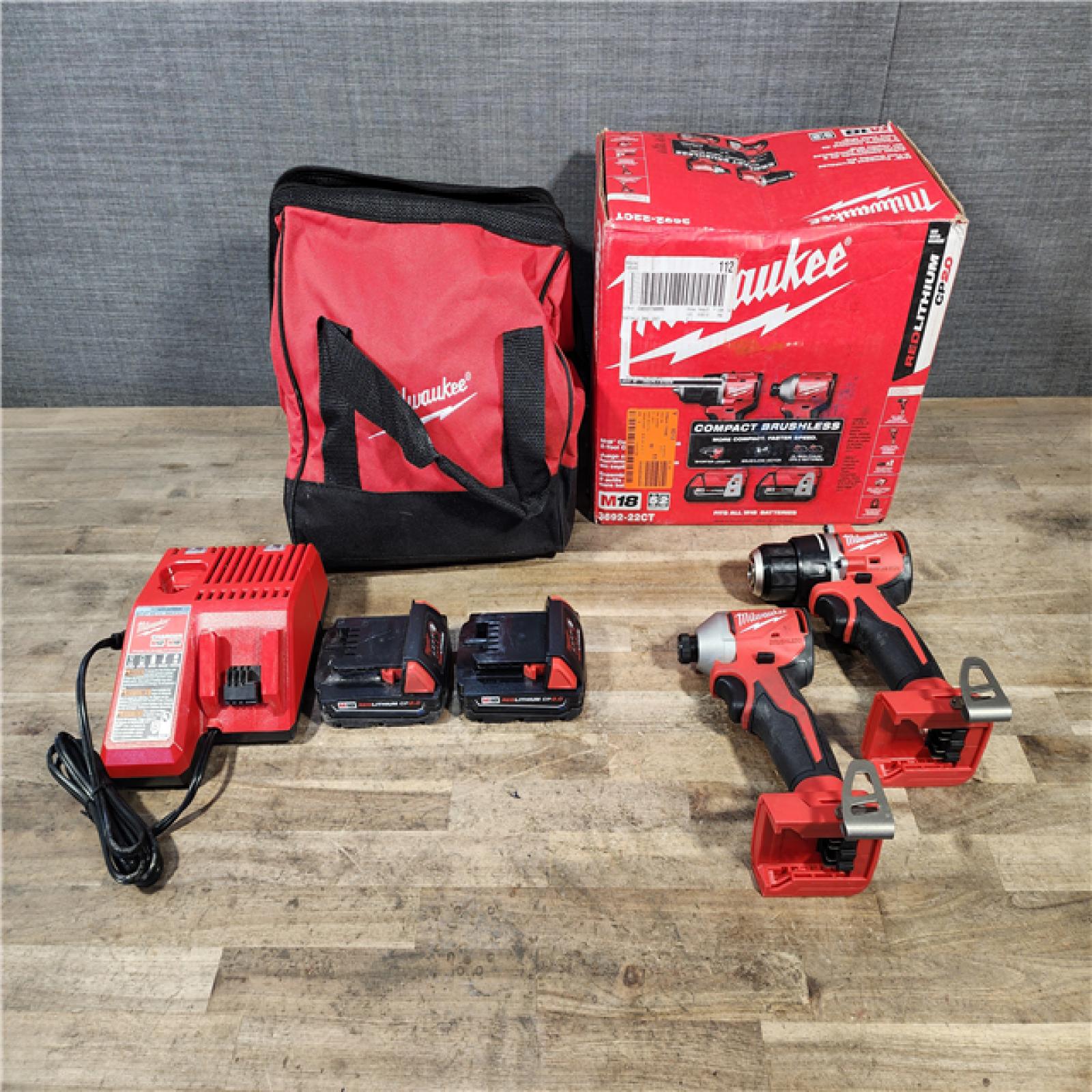 HOUSTON LOCATION - AS-IS Milwaukee M18 18V Lithium-Ion Brushless Cordless Compact Drill/Impact Combo Kit (2-Tool) W/(2) 2.0 Ah Batteries  Charger & Bag