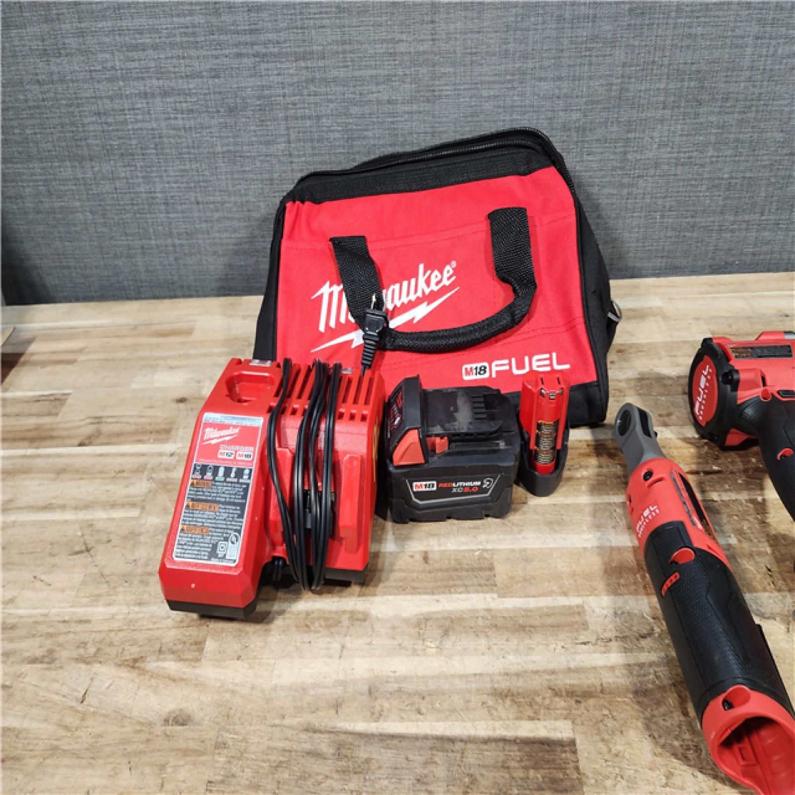 HOUSTON LOCATION - AS - IS Milwaukee FUEL 18V Cordless Mid Torque 1/2 in. Impact Wrench w/ 12 FUEL 3/8 in. Ratchet Combo Kit