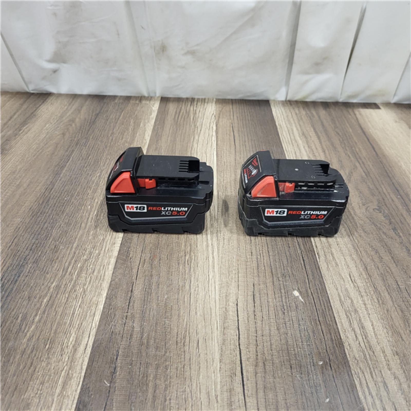 AS IS Milwaukee M18 18-Volt Lithium-Ion XC Starter Kit with Two 5.0Ah Batteries / Charger (48-59-1852B)