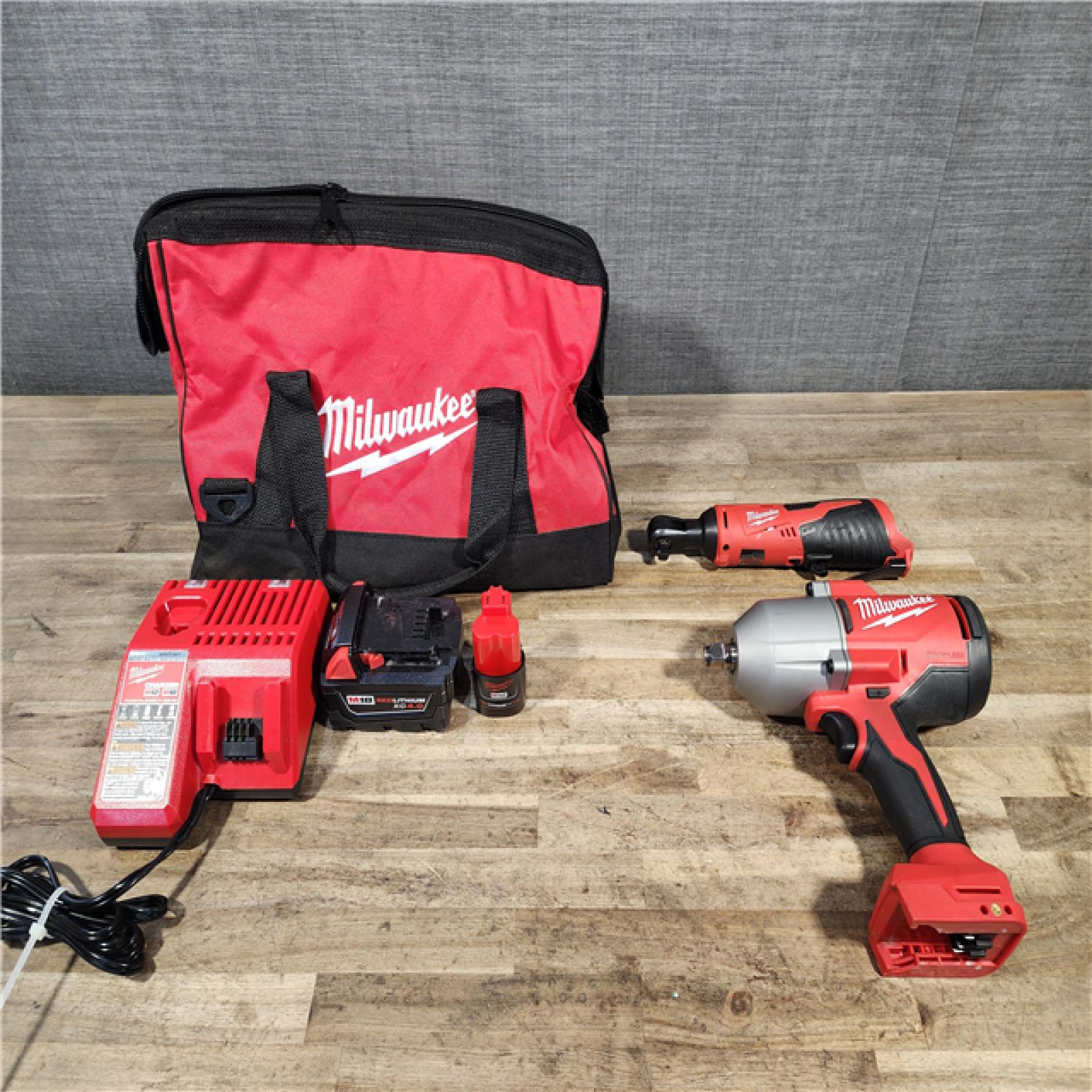 HOUSTON LOCATION - AS-IS Milwaukee 12/18V Lithium-Ion Cordless 3/8 in. Ratchet and 1/2 in. High Torque Impact Wrench with Friction Ring Combo Kit