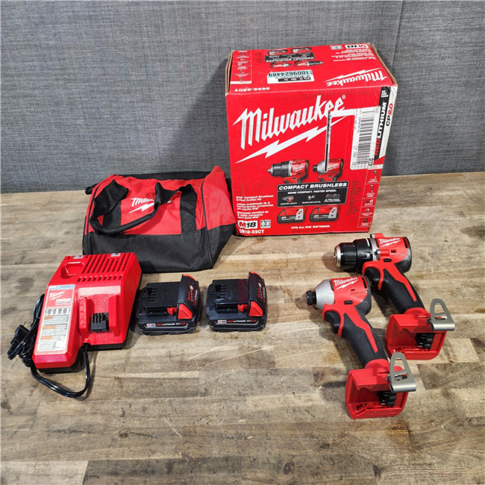 HOUSTON LOCATION - AS-IS Milwaukee M18 18V Lithium-Ion Brushless Cordless Compact Drill/Impact Combo Kit (2-Tool) W/(2) 2.0 Ah Batteries  Charger & Bag