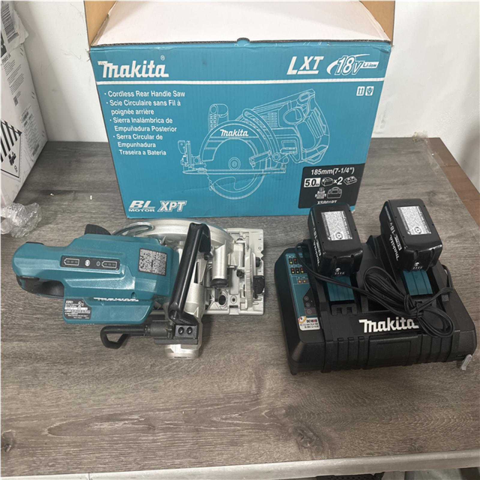 CALIFORNIA LIKE NEW MAKITA CORDLESS REAR HANDLE SAW CHARGER AND 2 BATTERIES