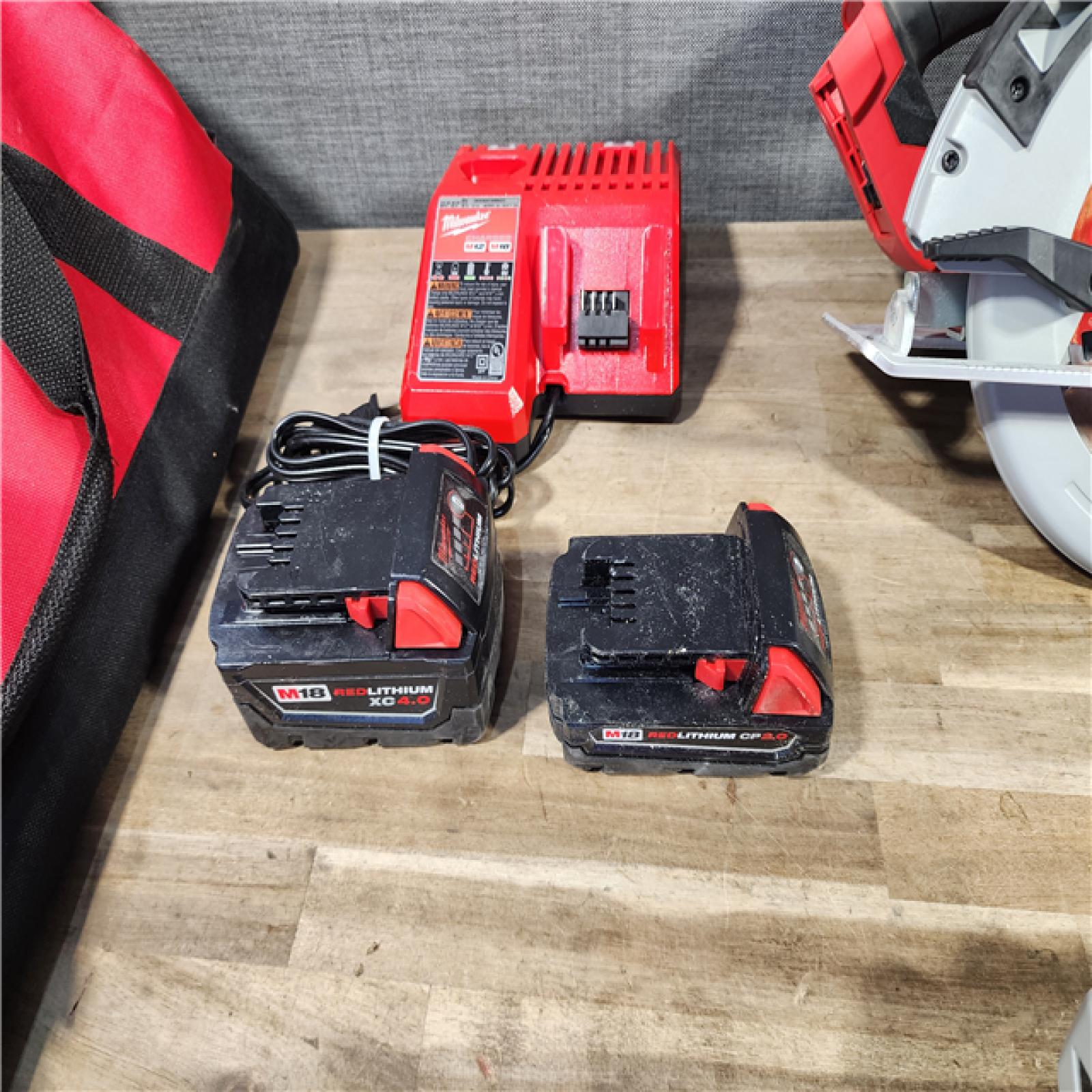 HOUSTON LOCATION - AS-IS MILWAUKEE 4 TOOL COMBO KIT W/ (2) BATTERY & CHARGER