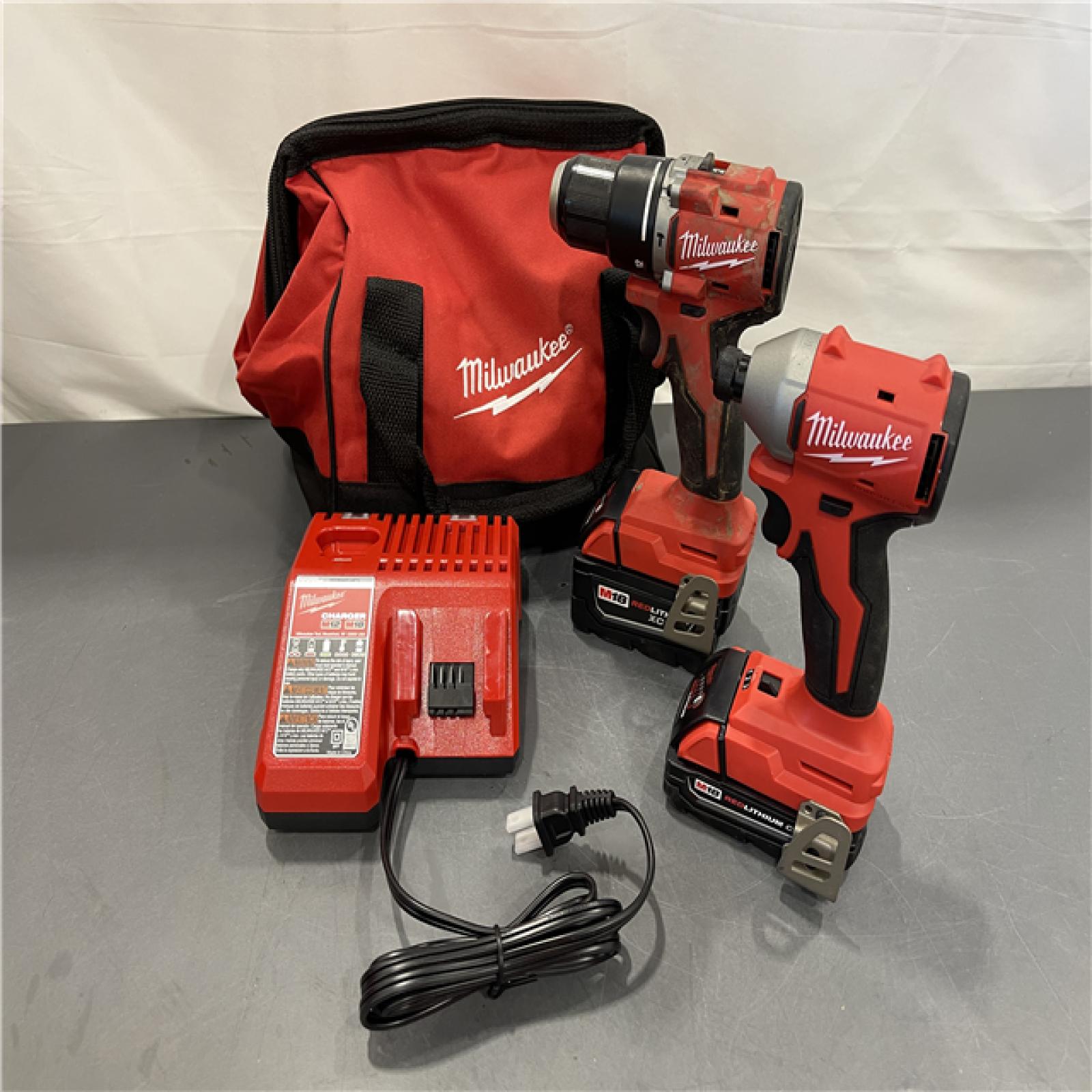 AS-IS - Milwaukee M18 18-Volt Lithium-Ion Brushless Cordless Compact Hammer Drill/Impact Combo Kit
