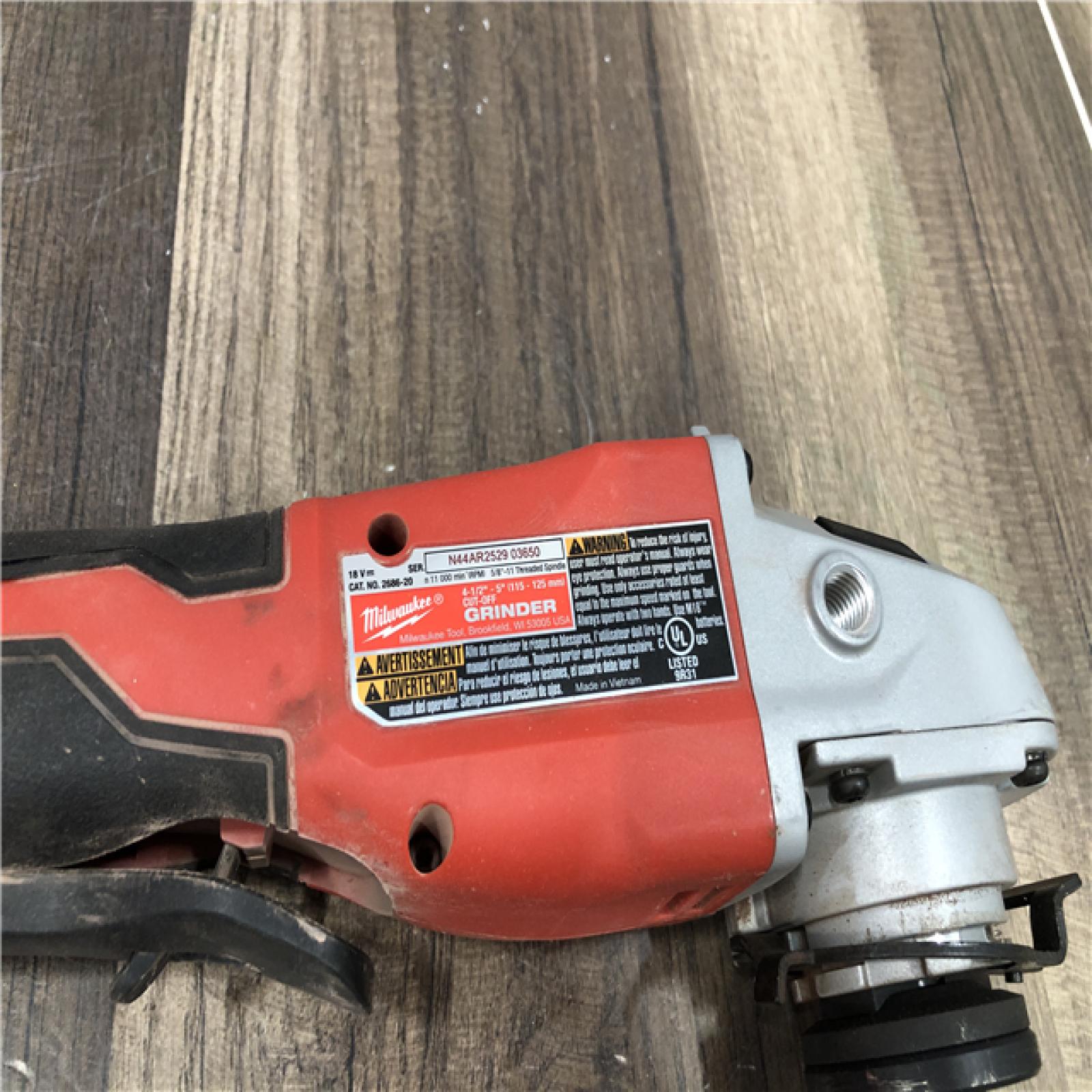 AS-IS Milwaukee 18V Lithium-Ion Brushless Cordless 4-1/2 in./5 in. Grinder w/Paddle Switch (Tool-Only)