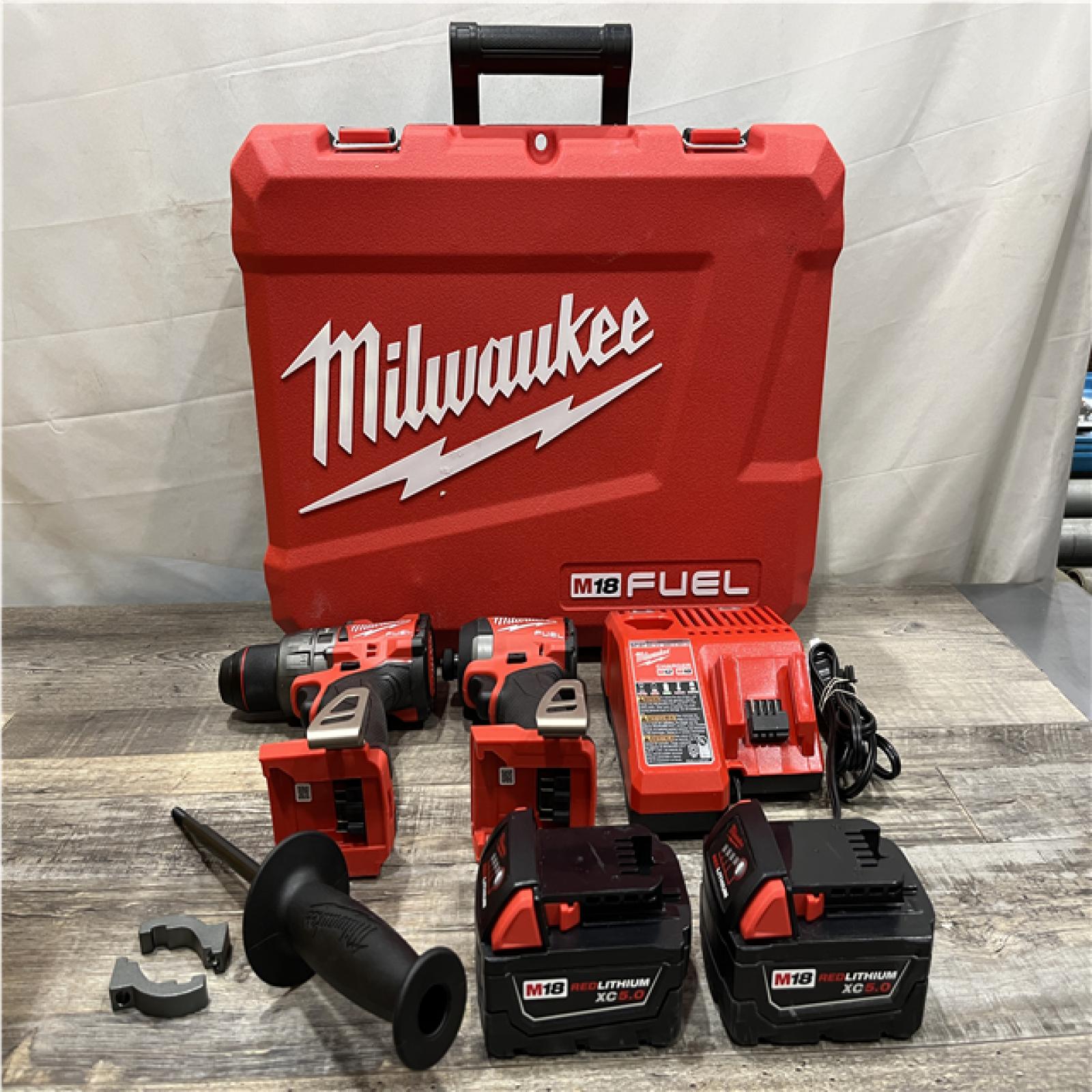AS-IS Milwaukee FUEL 18V Lithium-Ion Brushless Cordless Hammer Drill and Impact Driver Combo Kit