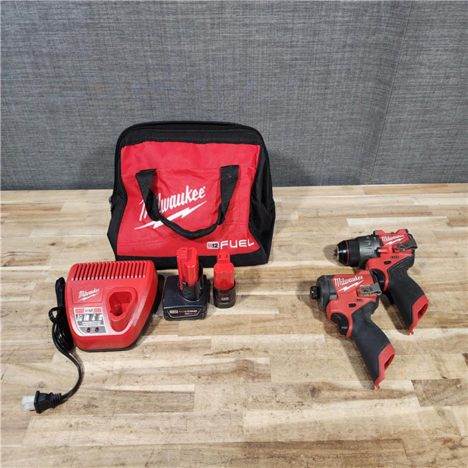 HOUSTON LOCATION - AS-IS Milwaukee  FUEL 12-Volt Lithium-Ion Brushless Cordless Hammer Drill and Impact Driver Combo Kit