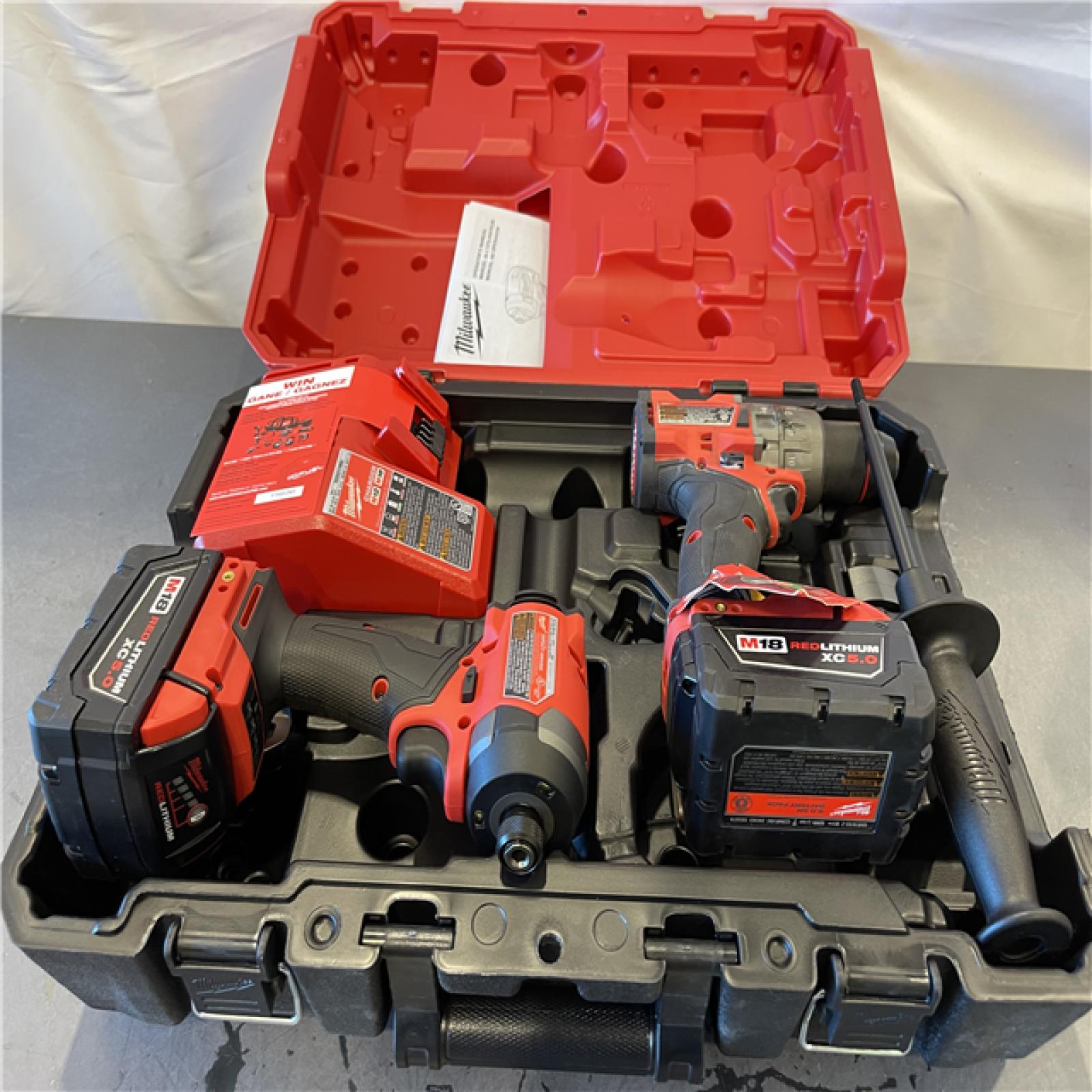 AS-IS - Milwaukee M18 FUEL 18V Lithium-Ion Brushless Cordless Hammer Drill and Impact Driver Combo Kit