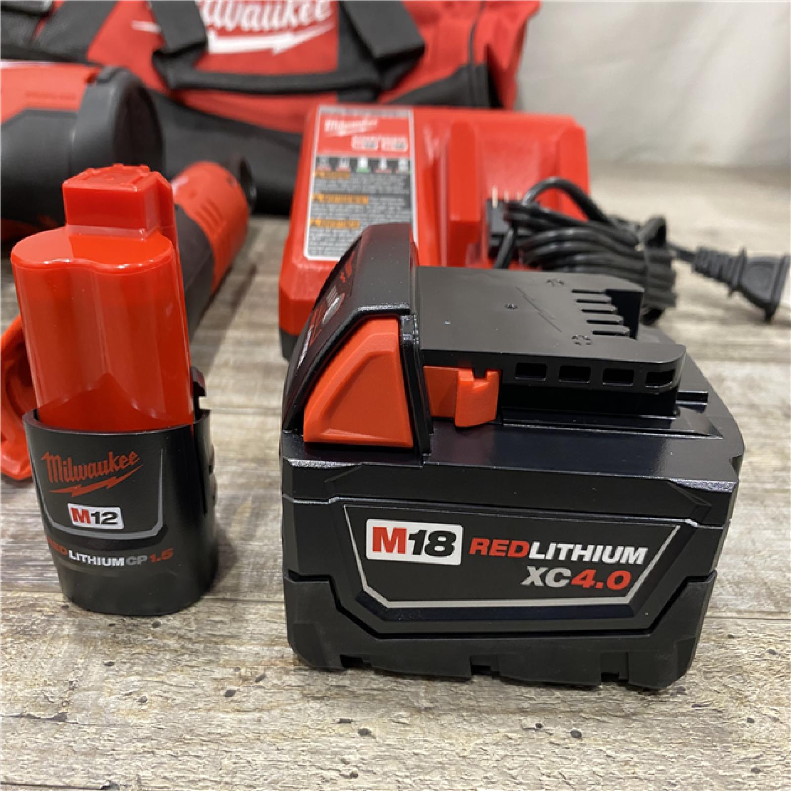 LIKE NEW - Milwaukee 12/18V Lithium-Ion Cordless 3/8 in. Ratchet and 1/2 in. High Torque Impact Wrench with Friction Ring Combo Kit