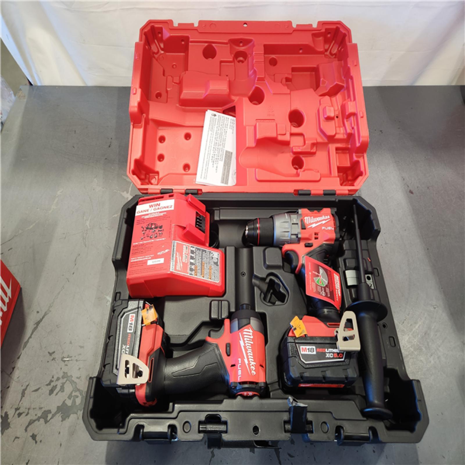 AS-IS- Milwaukee FUEL 18V Lithium-Ion Brushless Cordless Hammer Drill and Impact Driver Combo Kit (2-Tool) with 2 Batteries