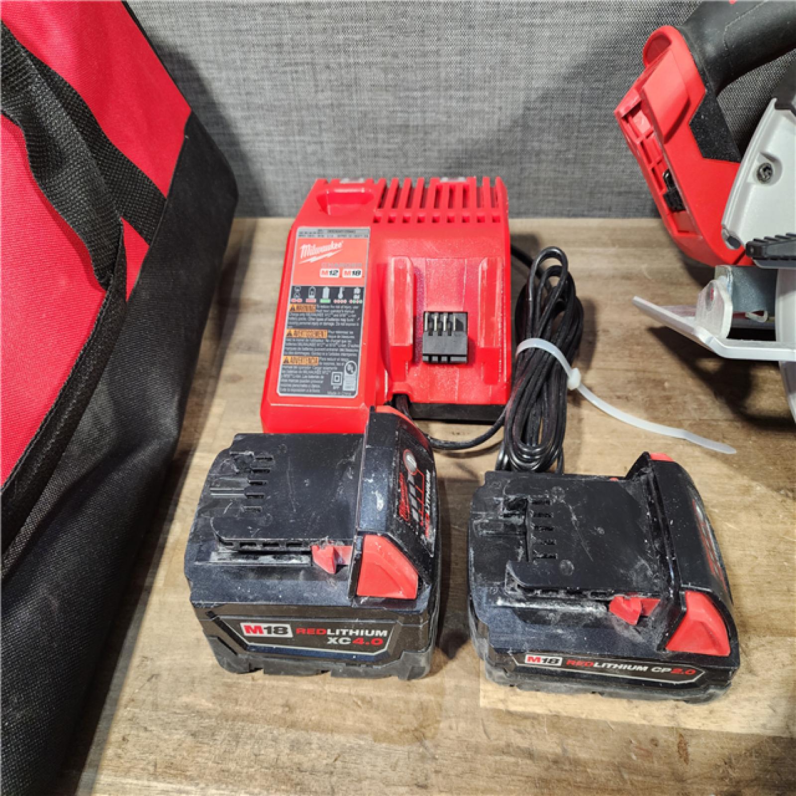 HOUSTON LOCATION - AS-IS MILWAUKEE 4 TOOL COMBO KIT W/ (2) BATTERY & CHARGER