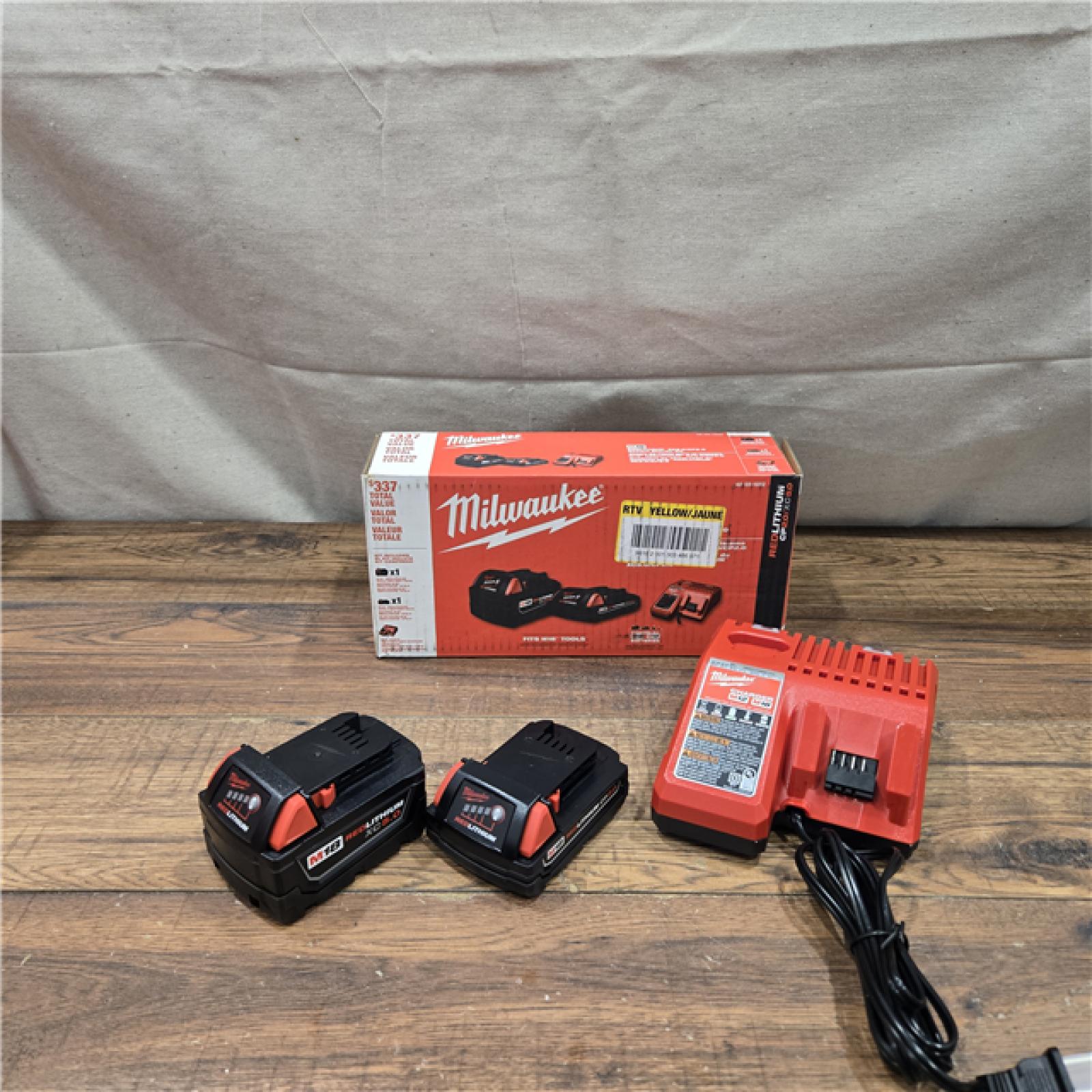 AS-IS Milwaukee M18 18-Volt Lithium-Ion Starter Kit with One 5.0 Ah and One 2.0 Ah Battery and Charger