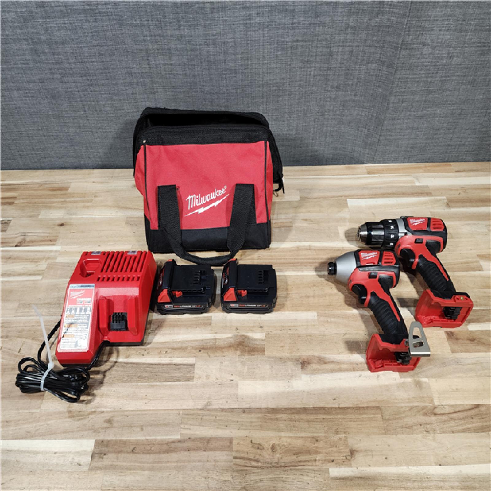 HOUSTON LOCATION - AS-IS Milwaukee  18V Lithium-Ion Cordless Drill Driver/Impact Driver Combo Kit
