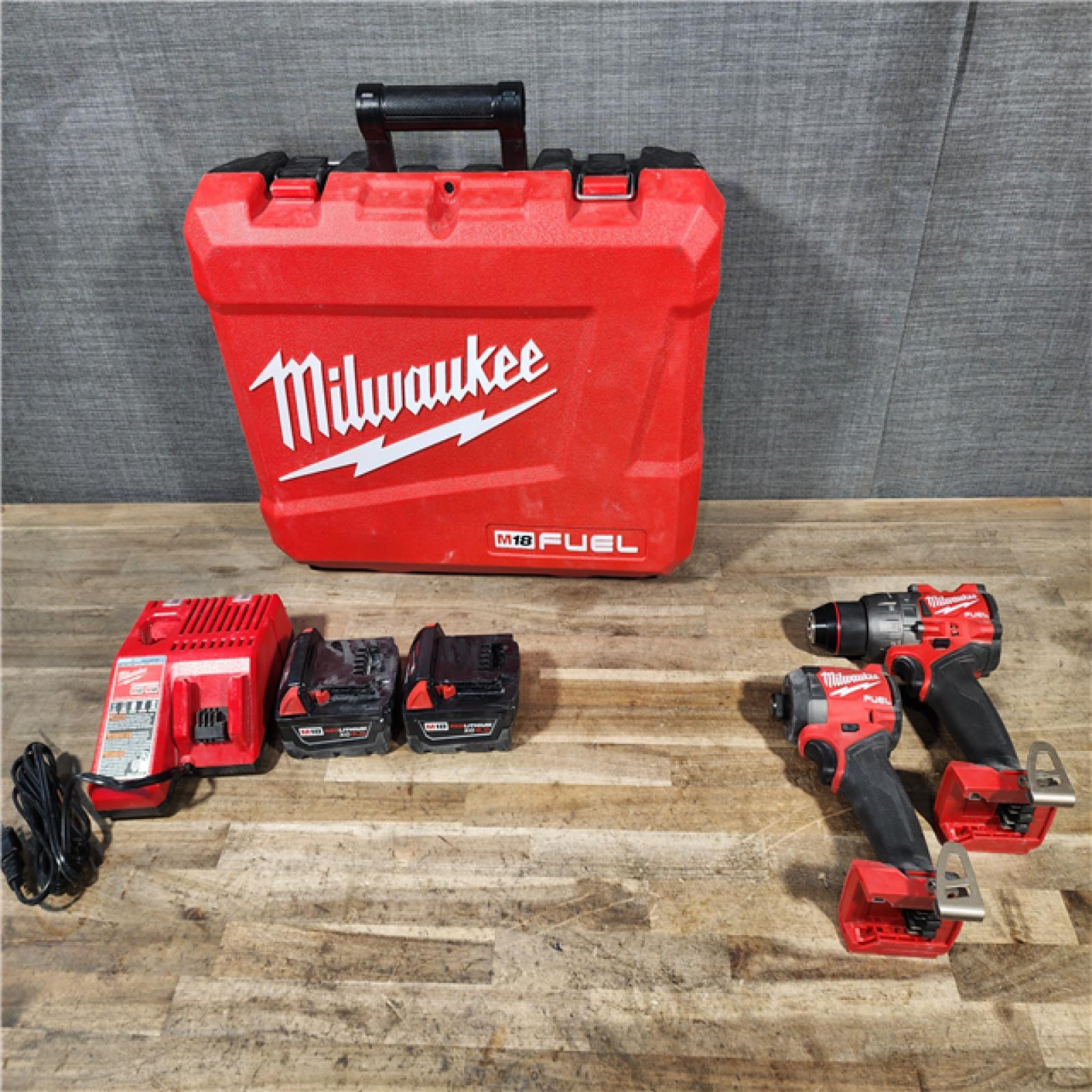 HOUSTON LOCATION - AS-IS Milwaukee FUEL 18V Lithium-Ion Brushless Cordless Hammer Drill and Impact Driver Combo Kit
