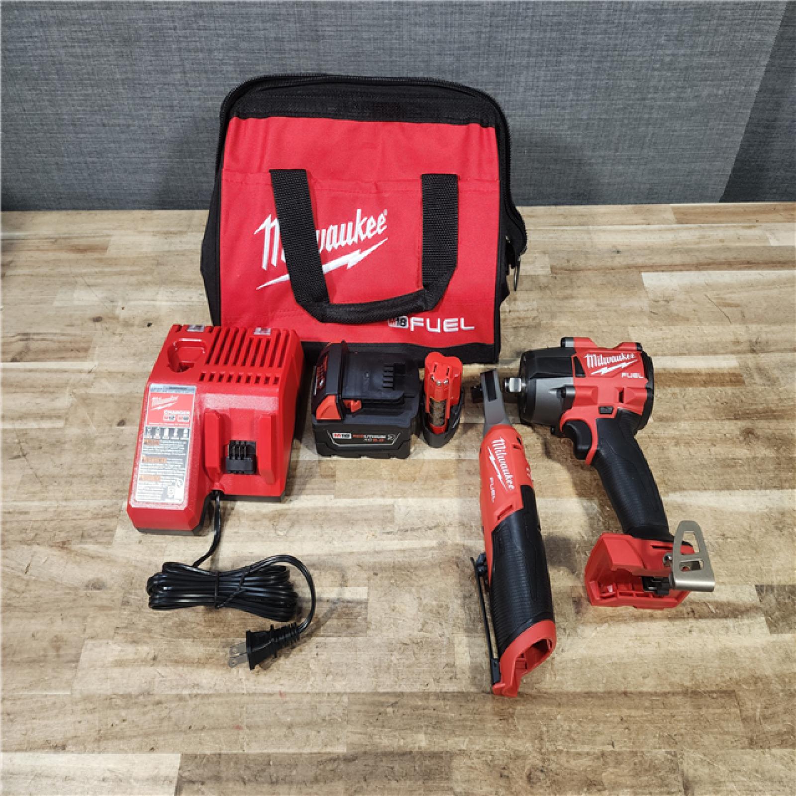 HOUSTON LOCATION - AS - IS Milwaukee FUEL 18V Cordless Mid Torque 1/2 in. Impact Wrench w/ 12 FUEL 3/8 in. Ratchet Combo Kit