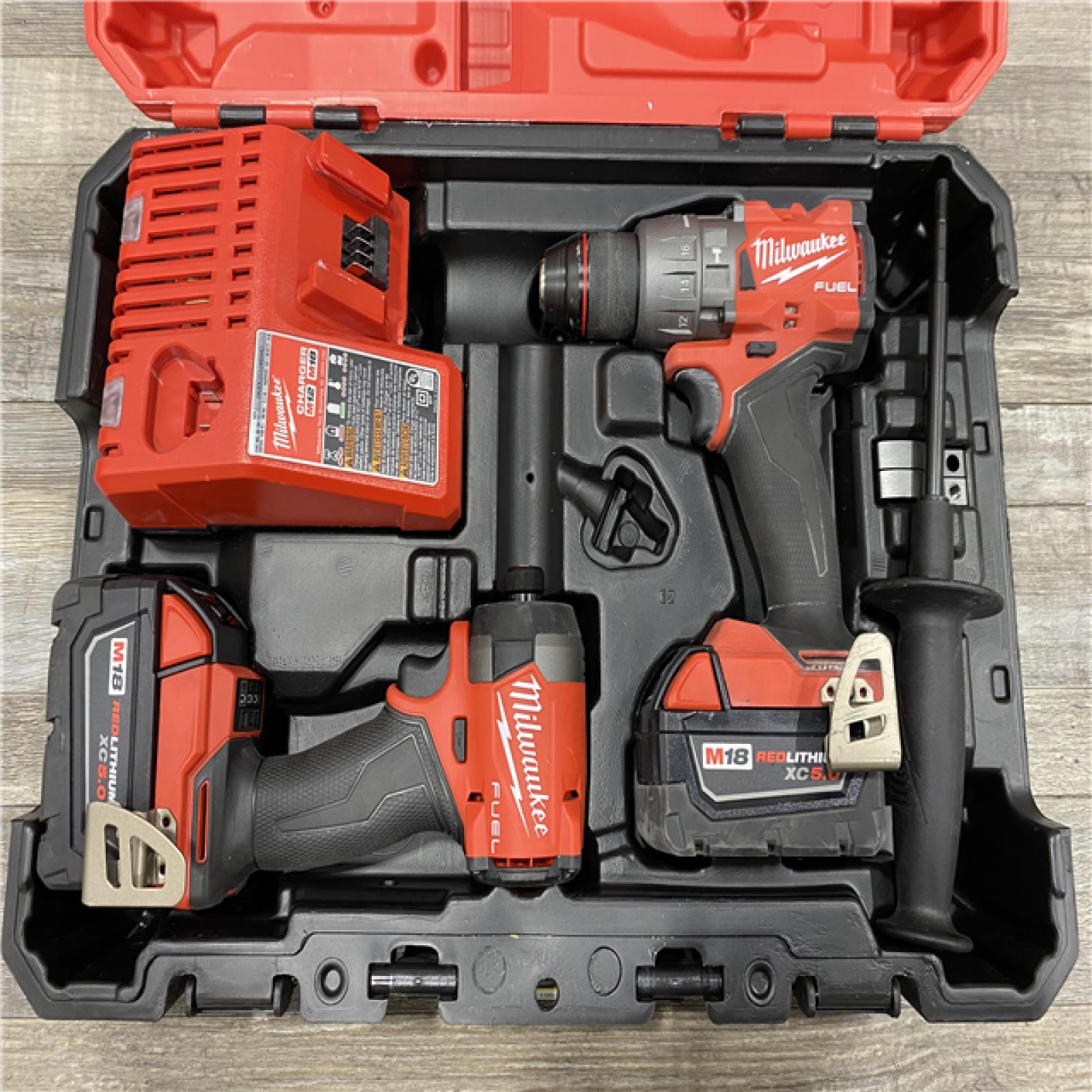 AS-IS Milwaukee 18V Lithium-Ion Brushless Cordless Hammer Drill and Impact Driver Combo Kit