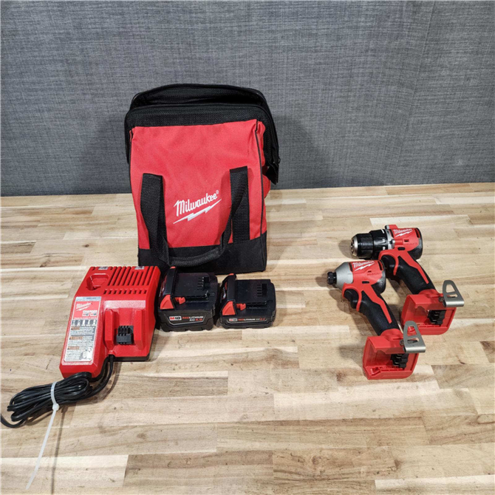 HOUSTON LOCATION - AS-IS M18 18-Volt Lithium-Ion Brushless Cordless Compact Hammer Drill/Impact Combo Kit (2-Tool) with (2) Batteries  Bag