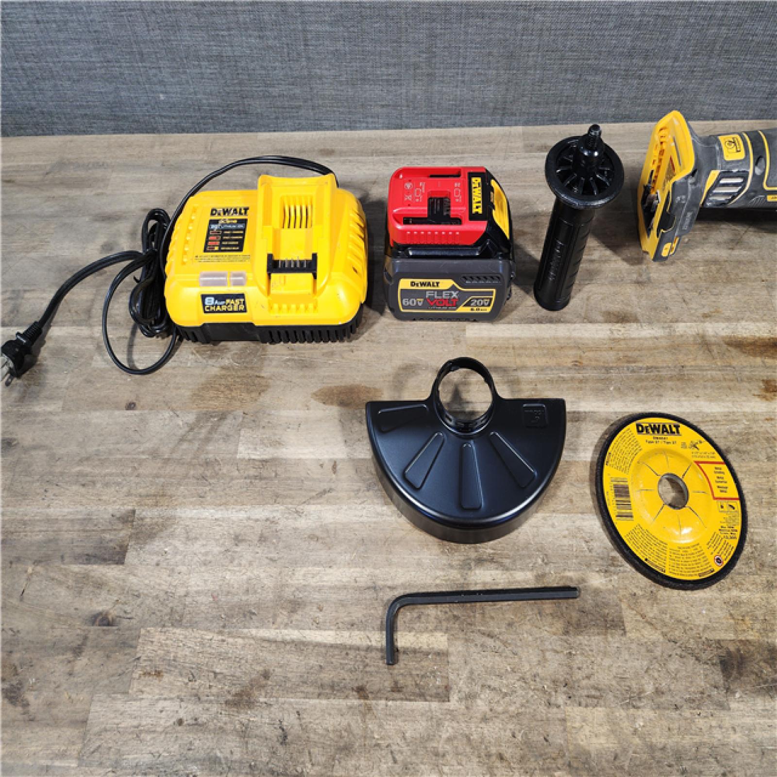 HOUSTON LOCATION - AS-IS DEWALT 20V MAX Cordless Brushless 4.5 - 5 in. Paddle Switch Angle Grinder with FLEXVOLT ADVANTAGE W/ BATTERY & CHARGER
